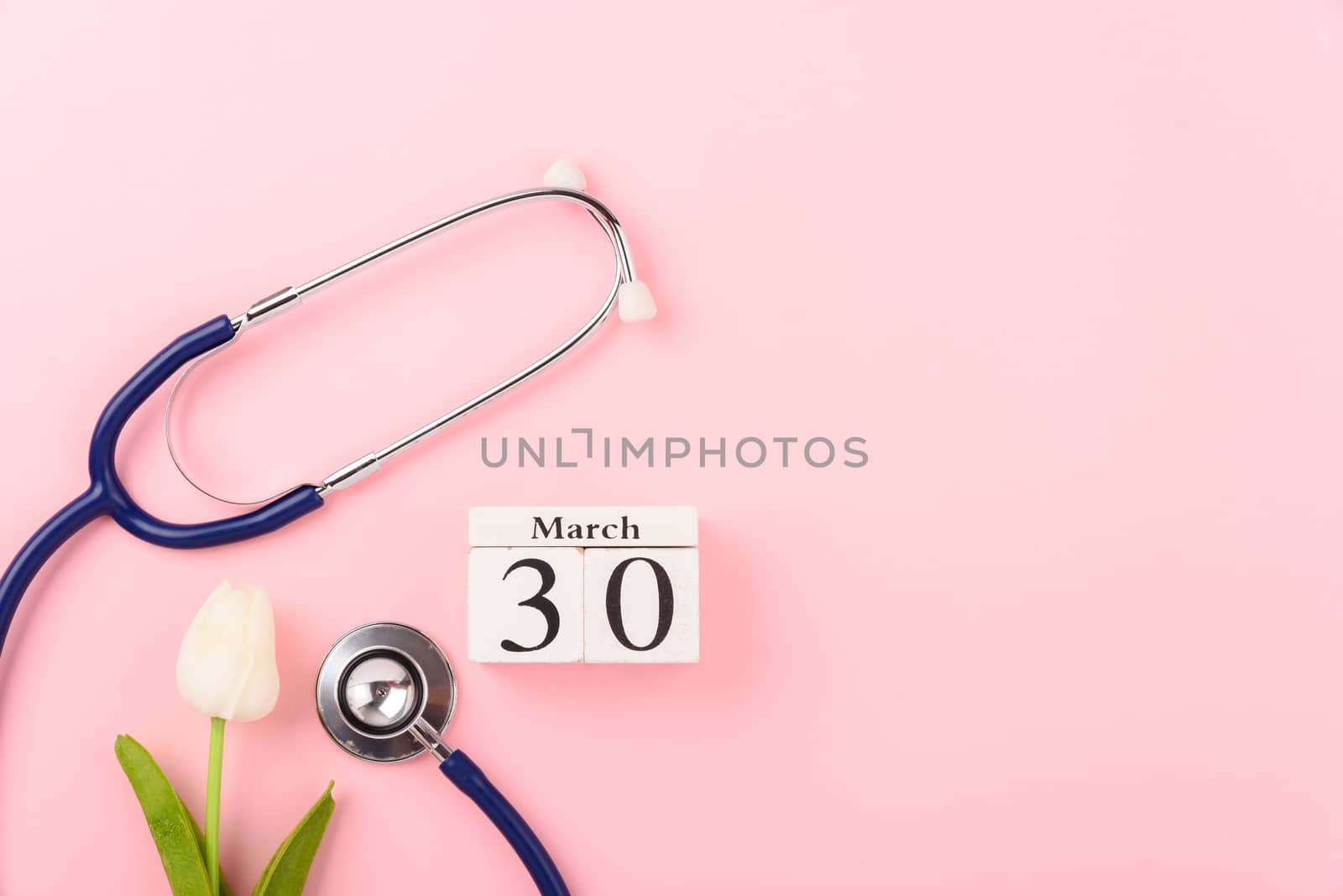 Doctor's Day concept, flat lay top view, equipment medical red heart and stethoscope on pink background, care patient in hospital with copy space for text