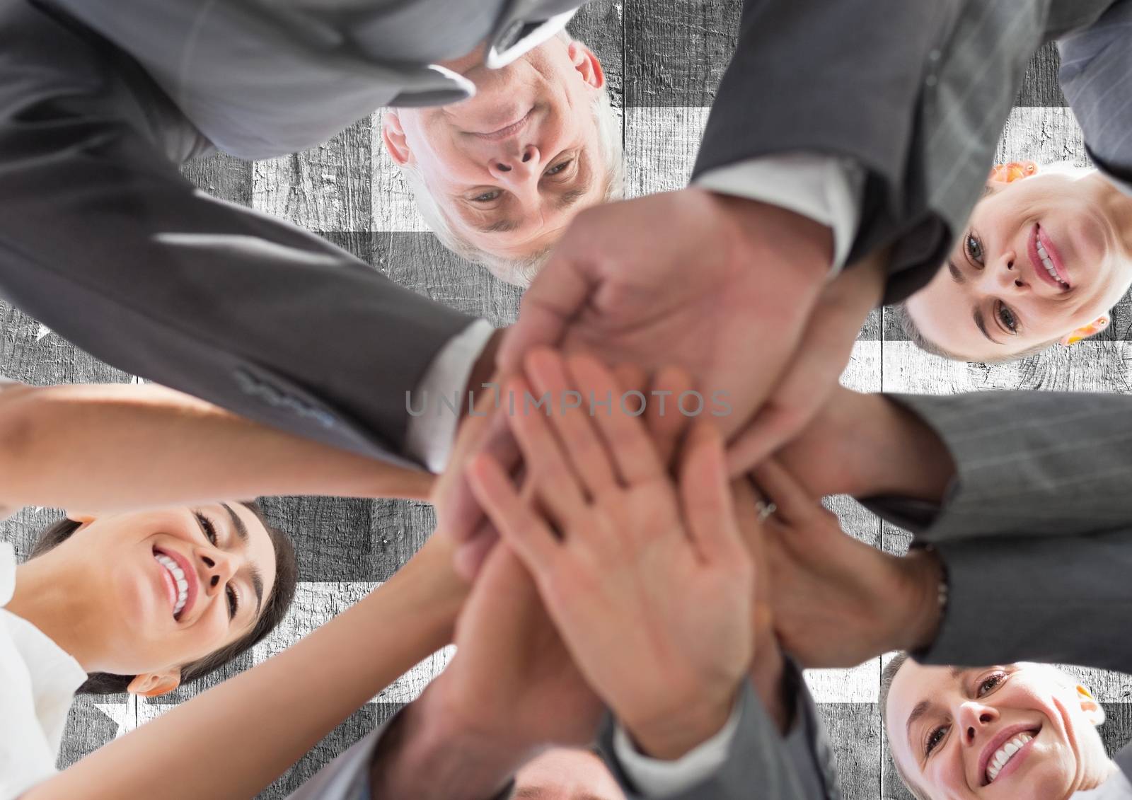 Business people with hands together by Wavebreakmedia