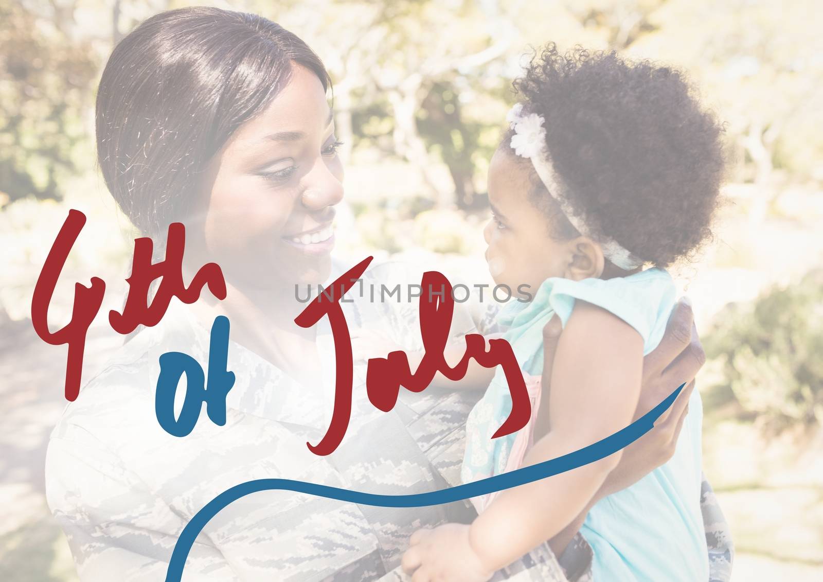 Mother holding her daughter for the 4th of July by Wavebreakmedia