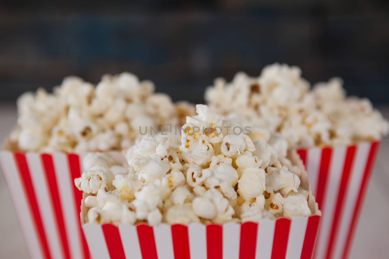 Close-up of popcorn arranged on wooden table with 4th july theme