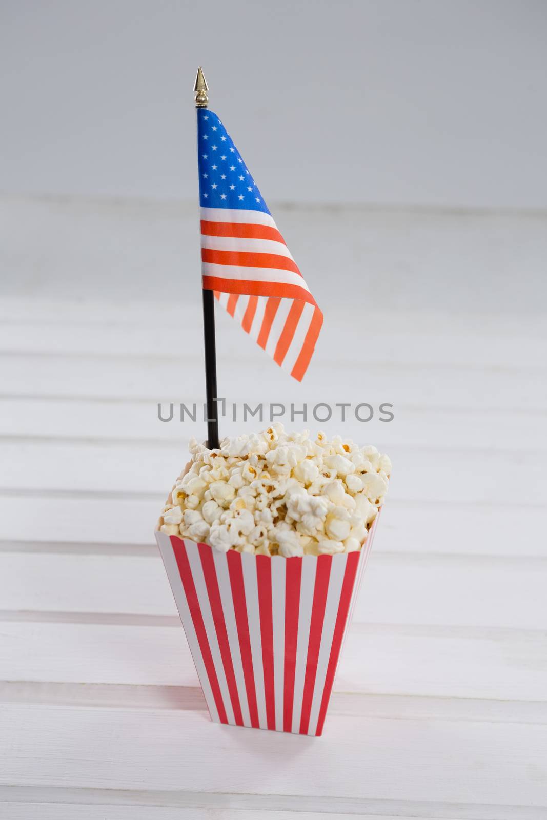 Close-up of popcorn with 4th july theme on wooden table