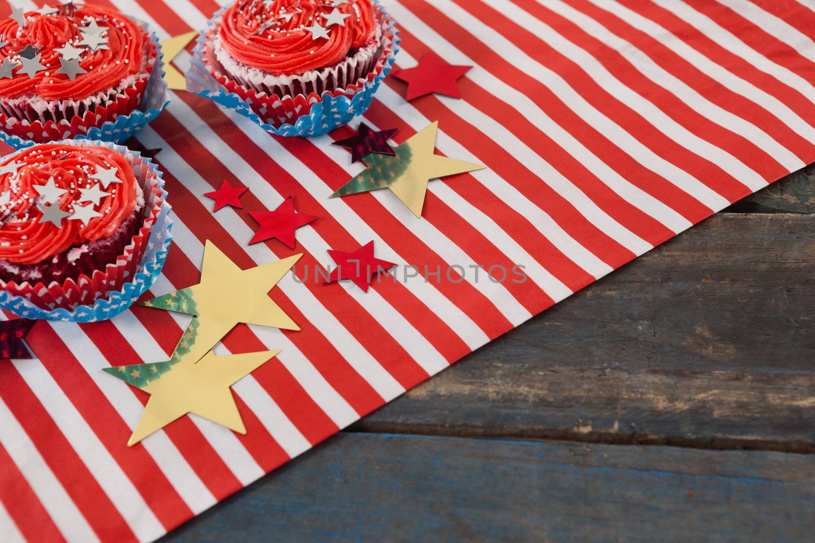 Decorated cupcakes with 4th july theme on wooden table