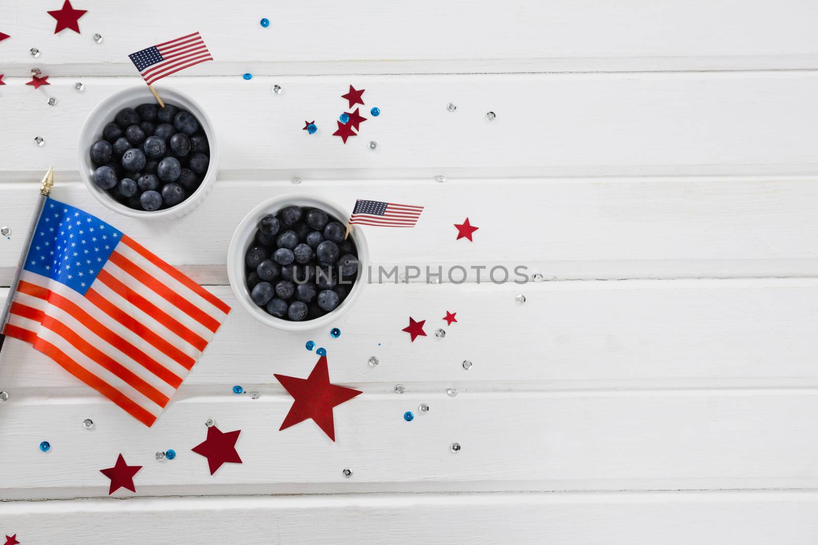 Black berries in bowls with 4th july theme by Wavebreakmedia