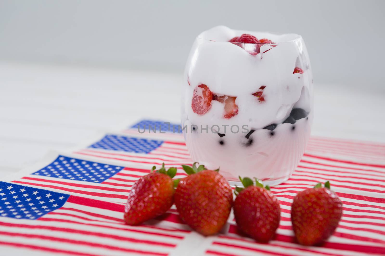 Fruit ice cream with 4th july theme on wooden table