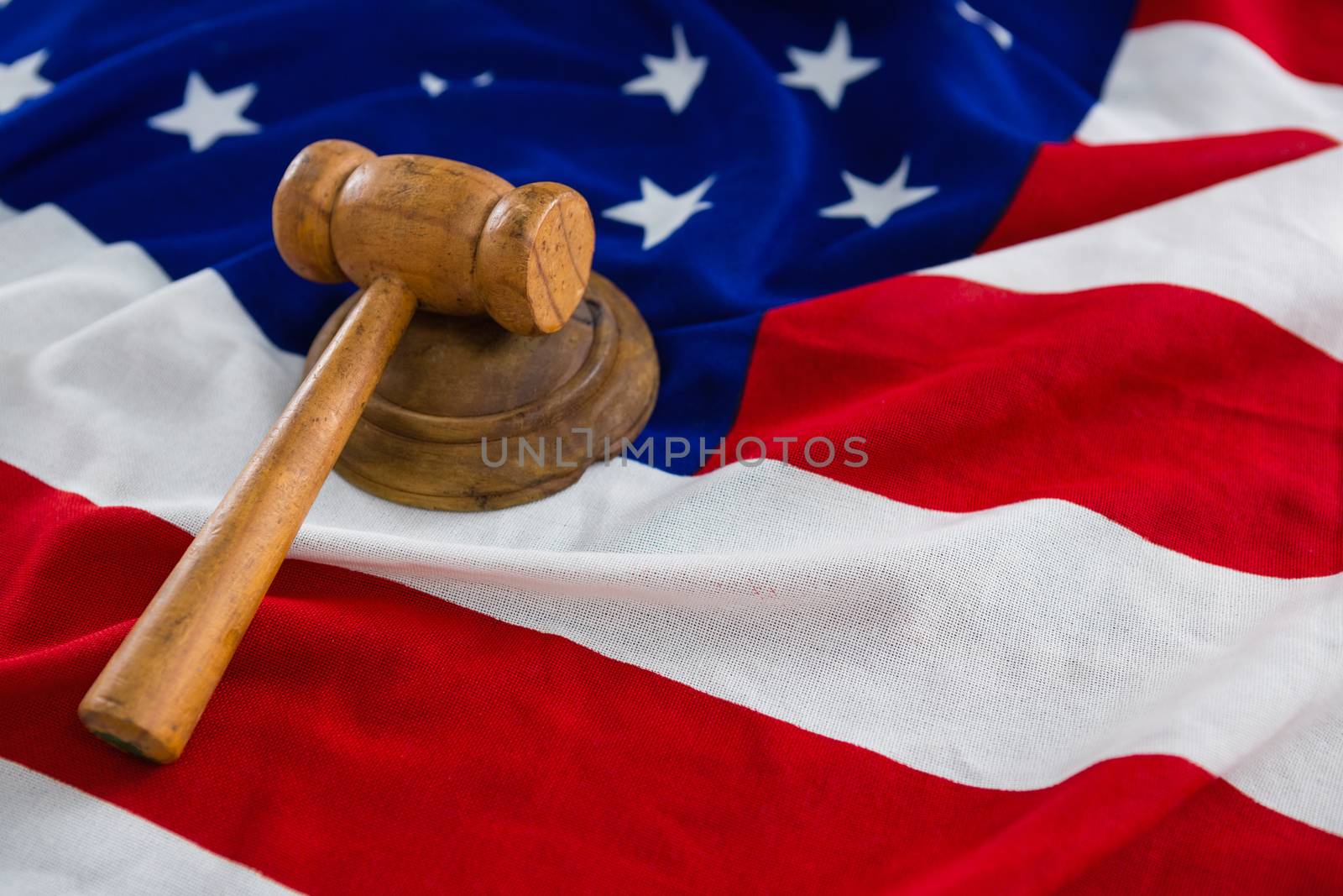 Close-up of gavel on American flag by Wavebreakmedia