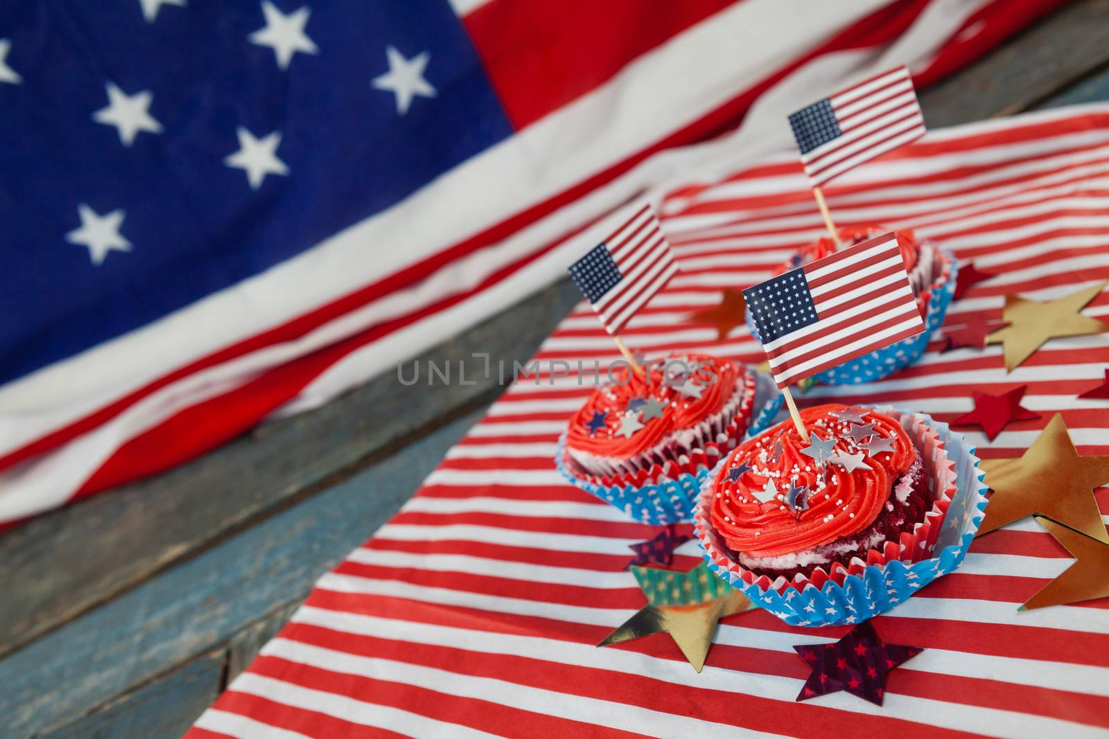 Decorated cupcakes with 4th july theme on wooden table
