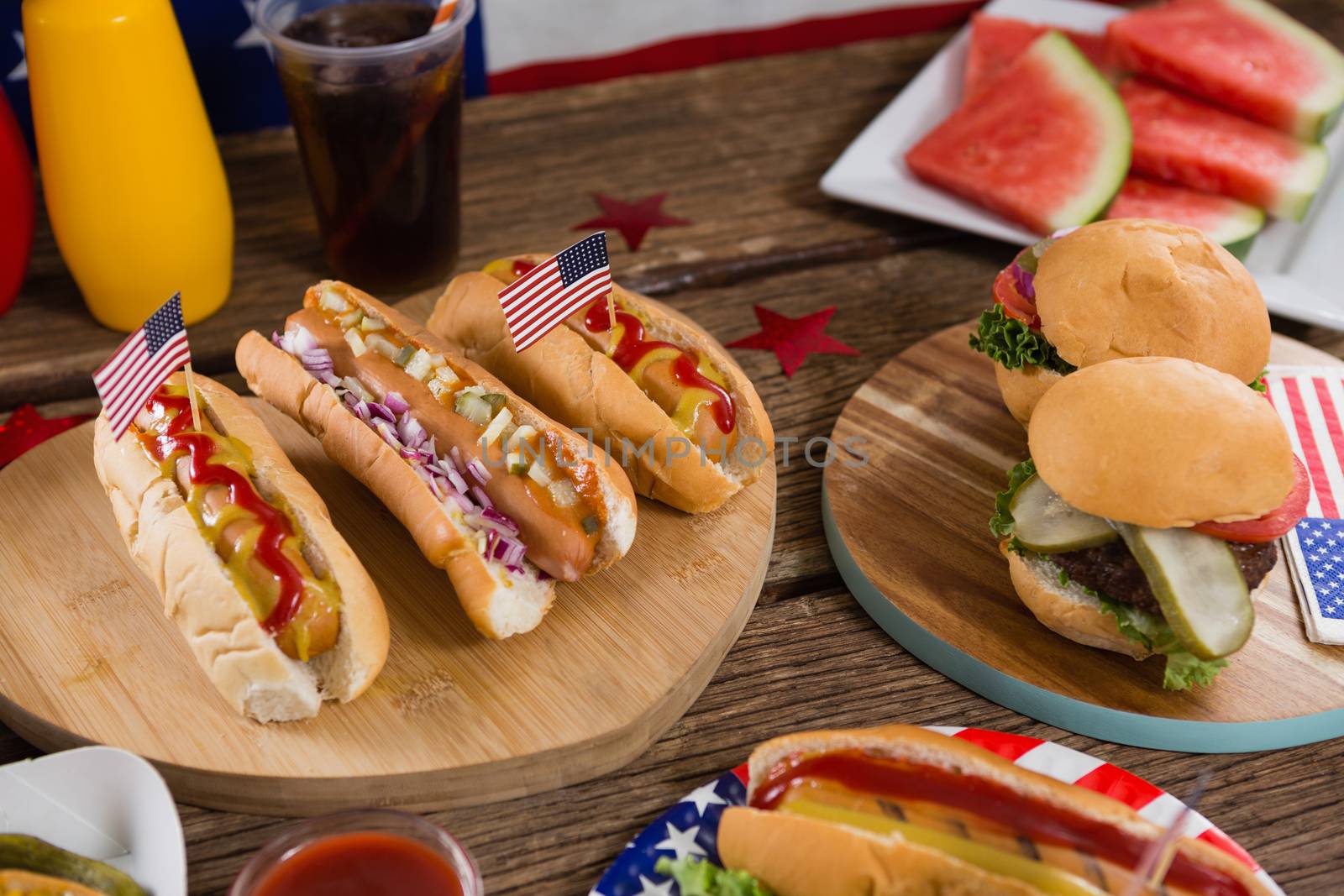 Close-up of hot dogs on wooden table with 4th july theme