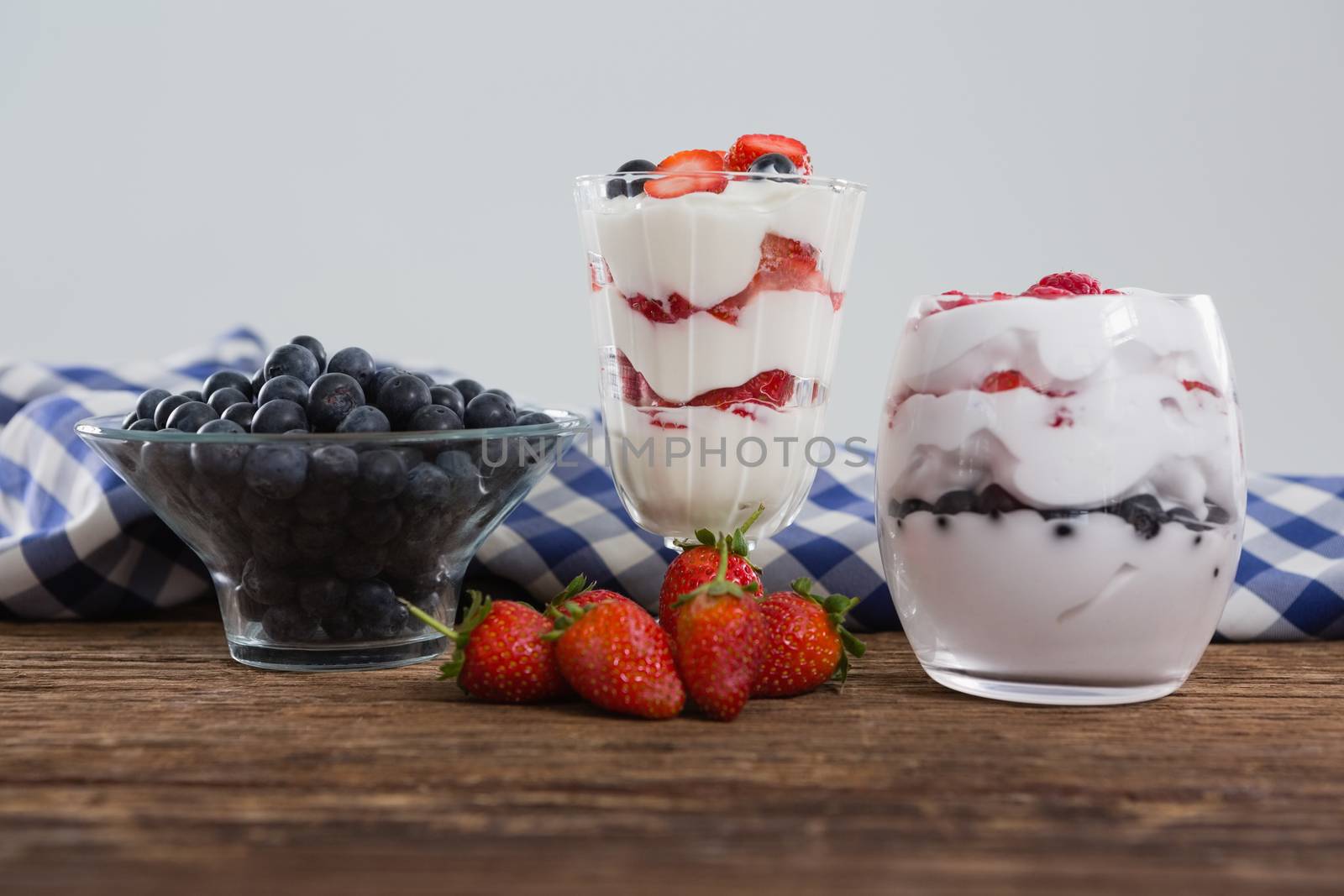 Fruit ice cream on wooden table by Wavebreakmedia