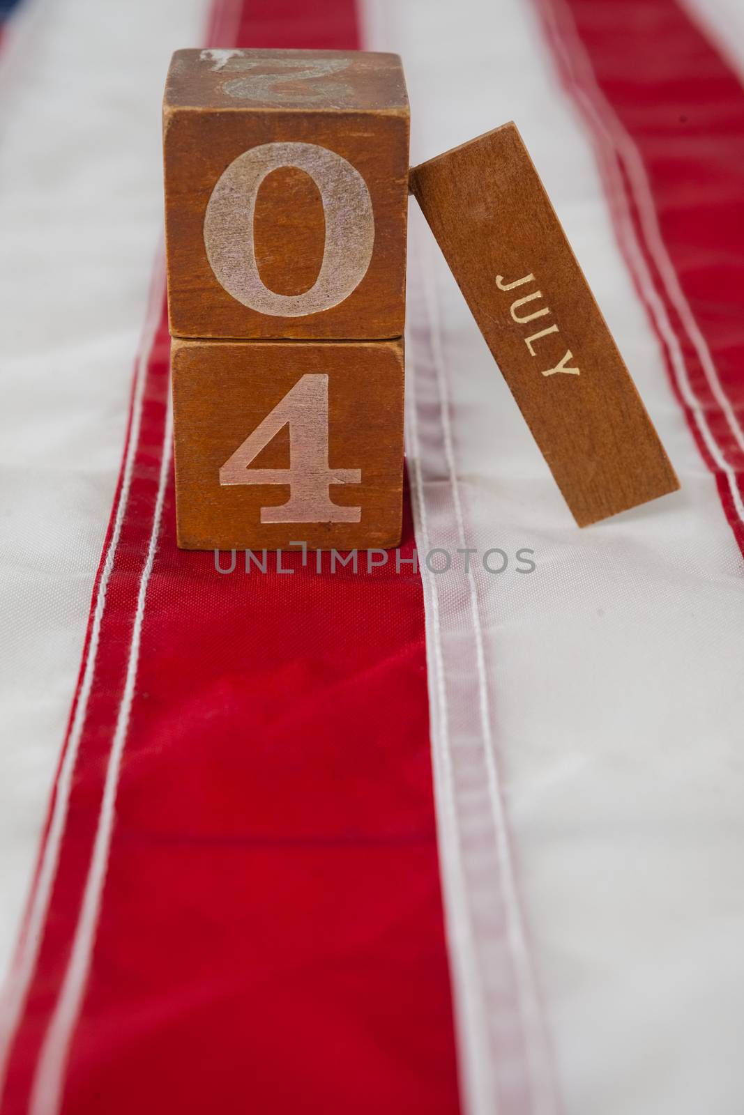 Dates blocks on American flag with 4th july theme by Wavebreakmedia