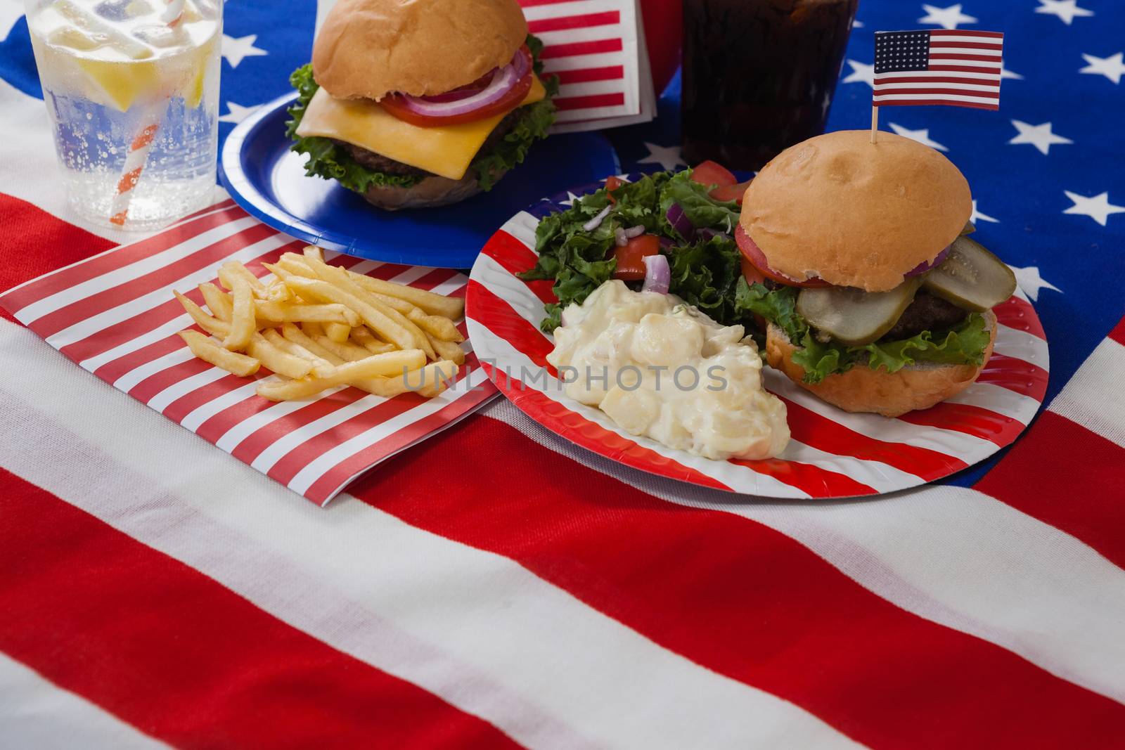 Snacks and drink decorated with 4th july theme on table