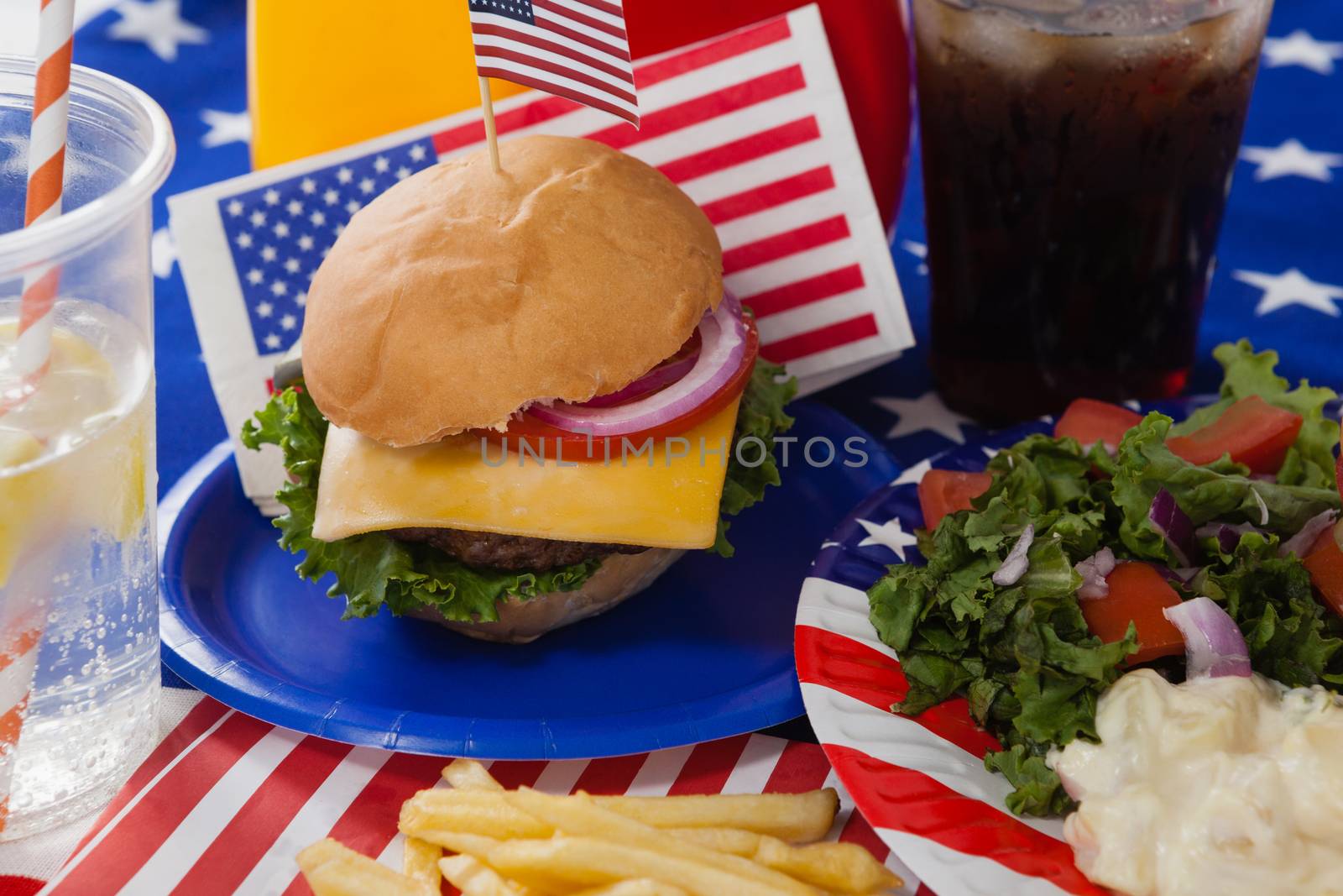 Close-up of drink and snacks decorated with 4th july theme