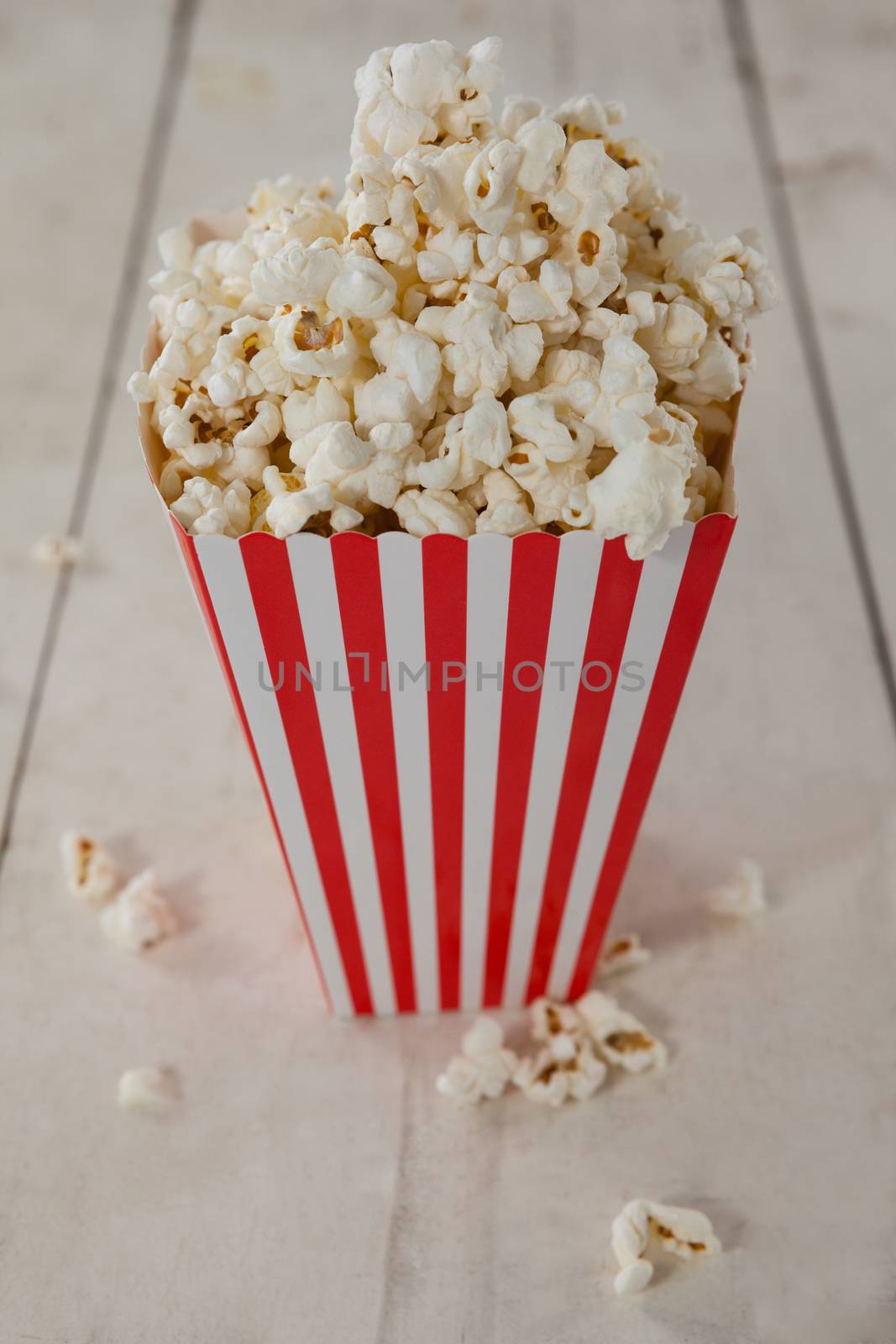 Close-up of popcorn with 4th july theme on wooden table