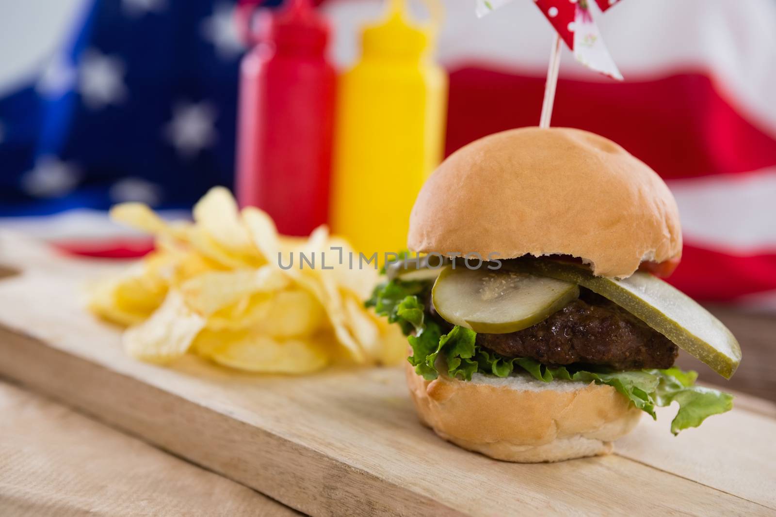 Close-up of burger on wooden board by Wavebreakmedia