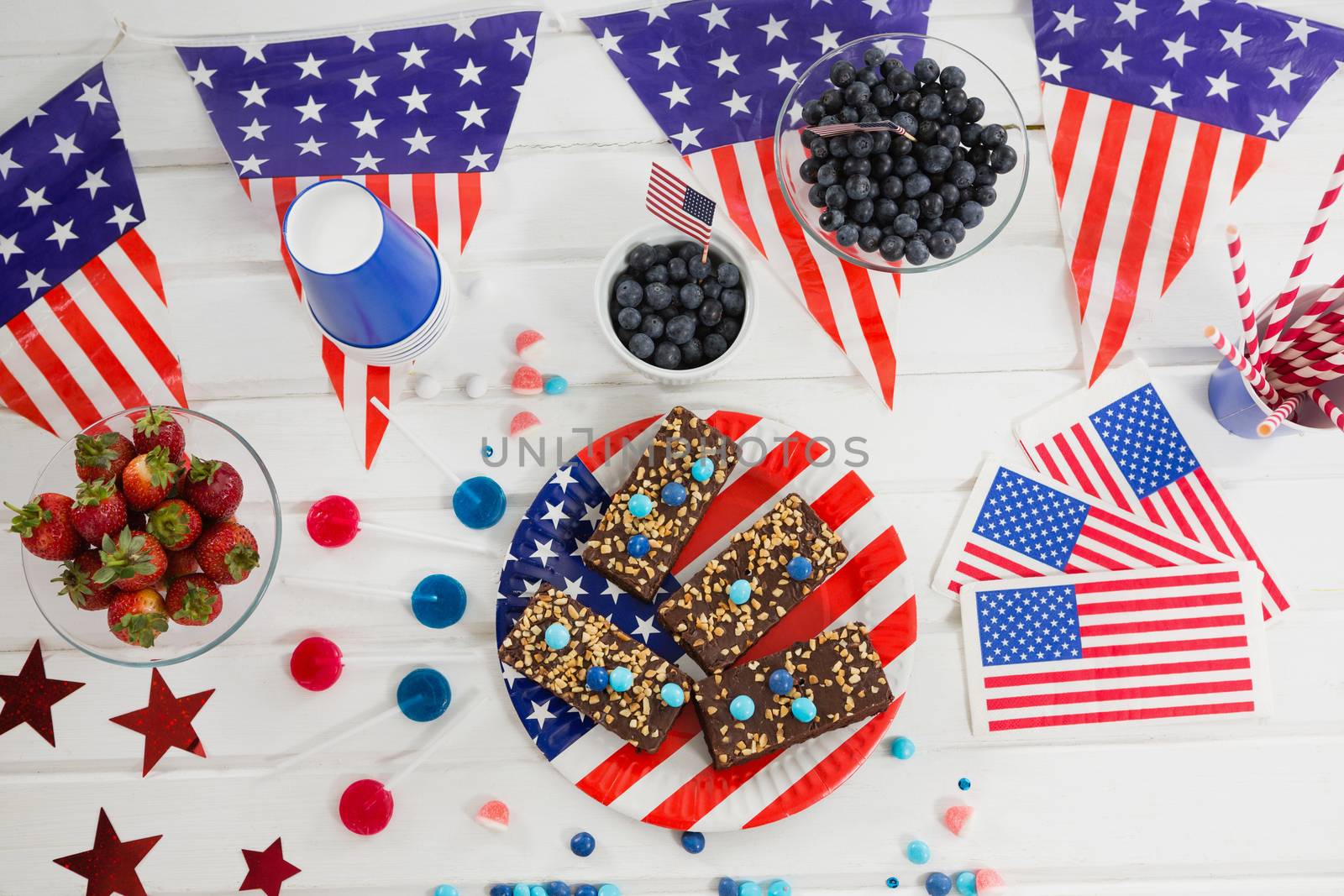 Sweet food and fruits decorated with 4th july theme by Wavebreakmedia