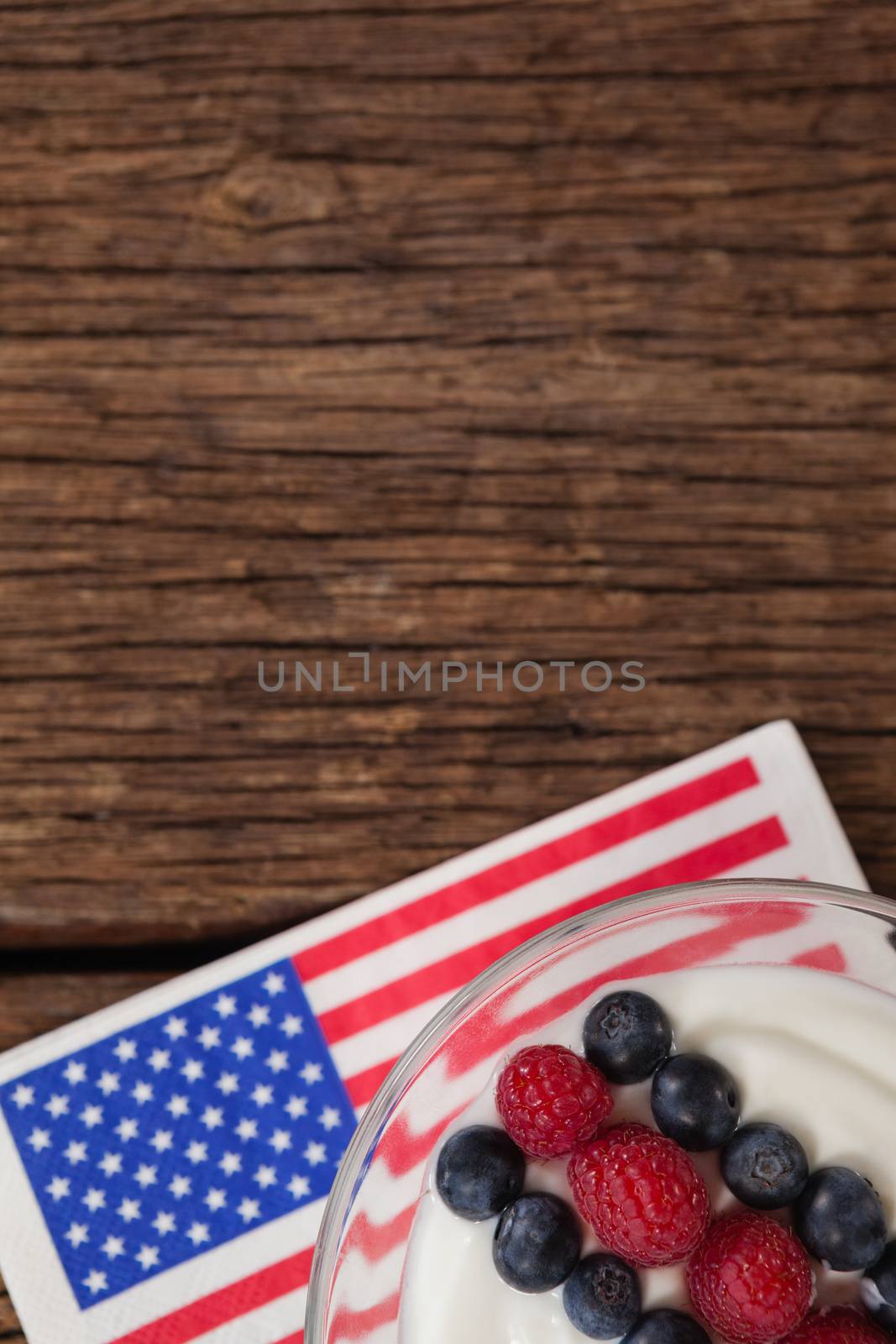 Close-up of fruit ice cream with 4th july theme on wooden table