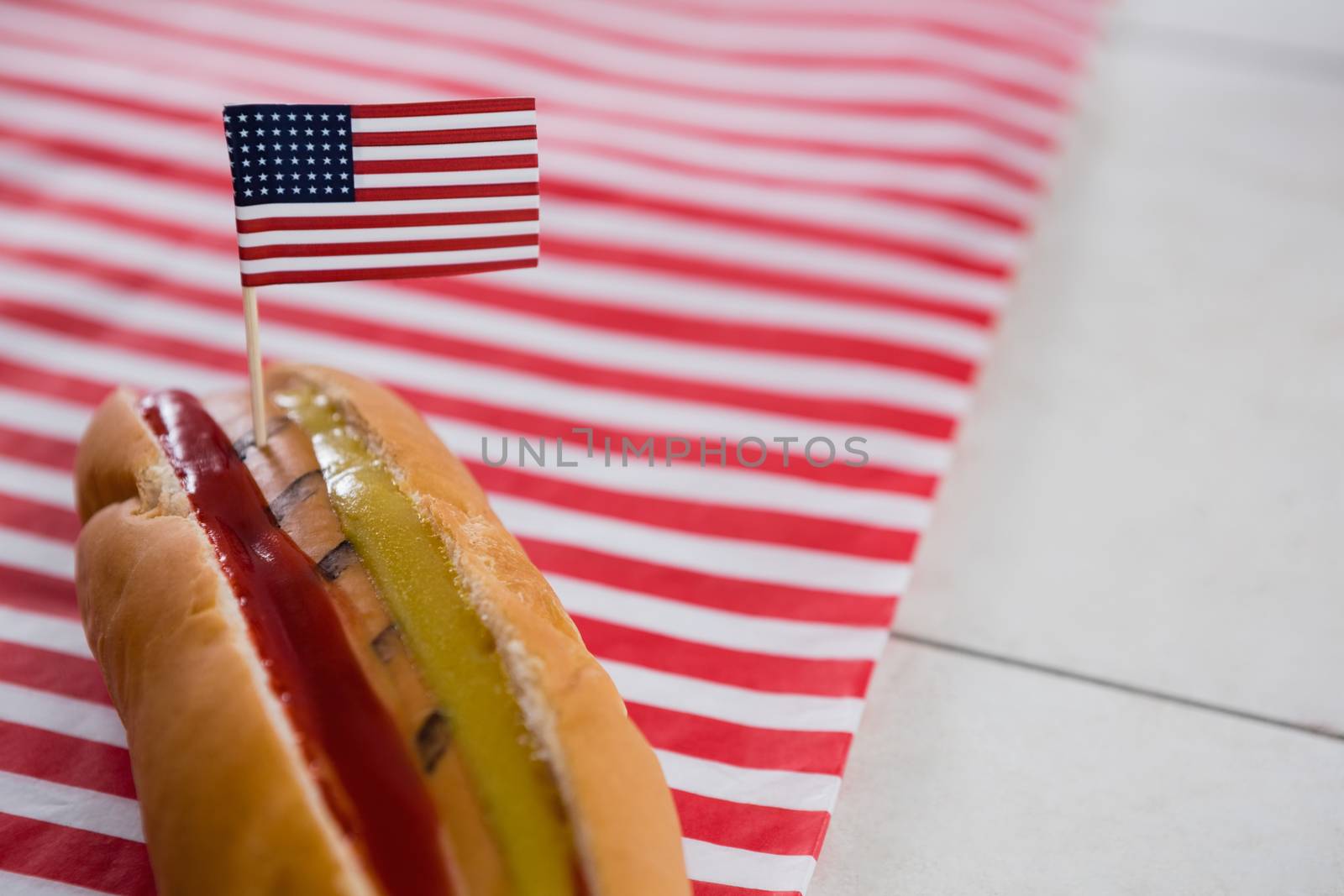 Close-up of Hot dog on wooden table with 4th july theme