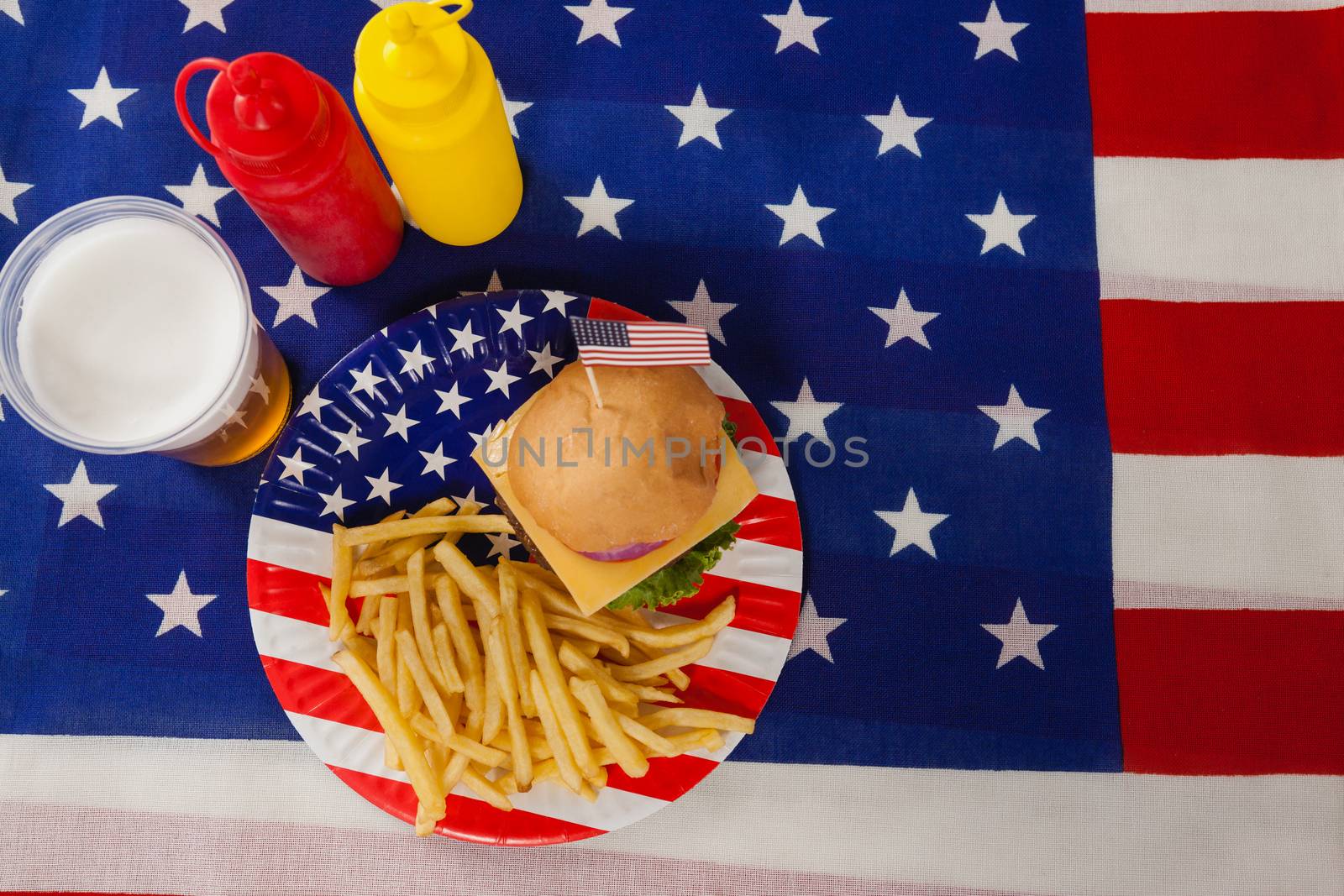 Snacks and drink  decorated with 4th july theme by Wavebreakmedia