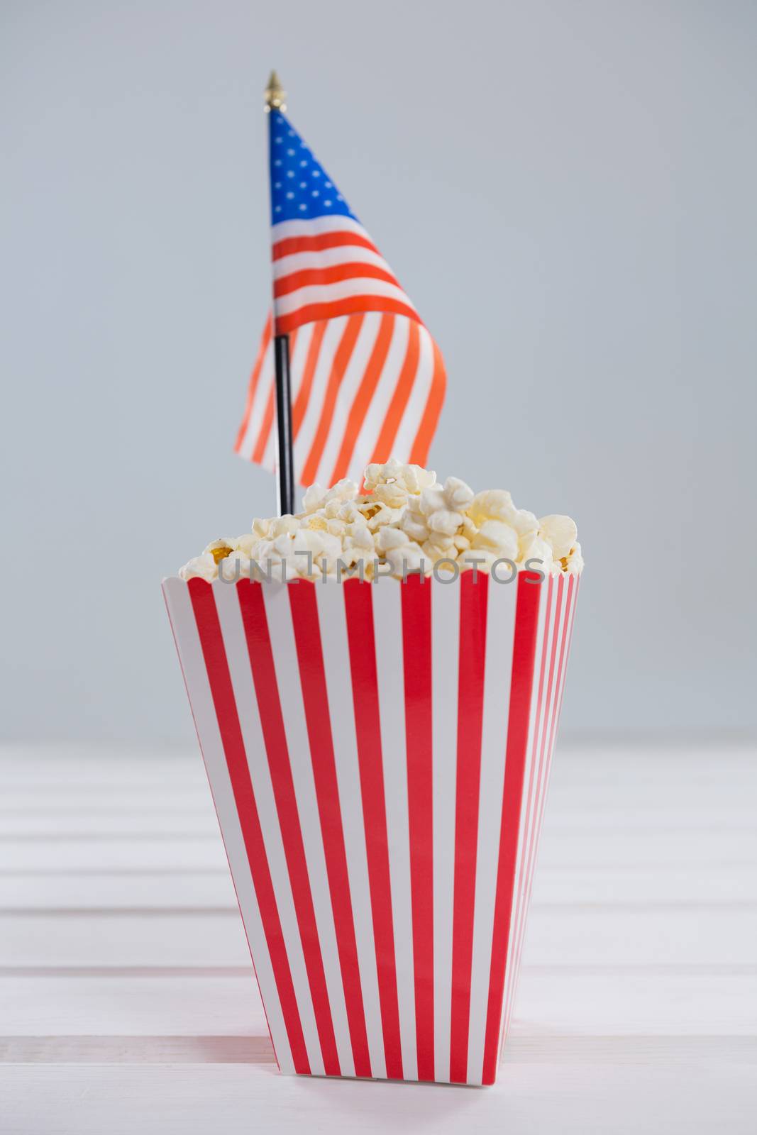 Close-up of popcorn with 4th july theme on wooden table