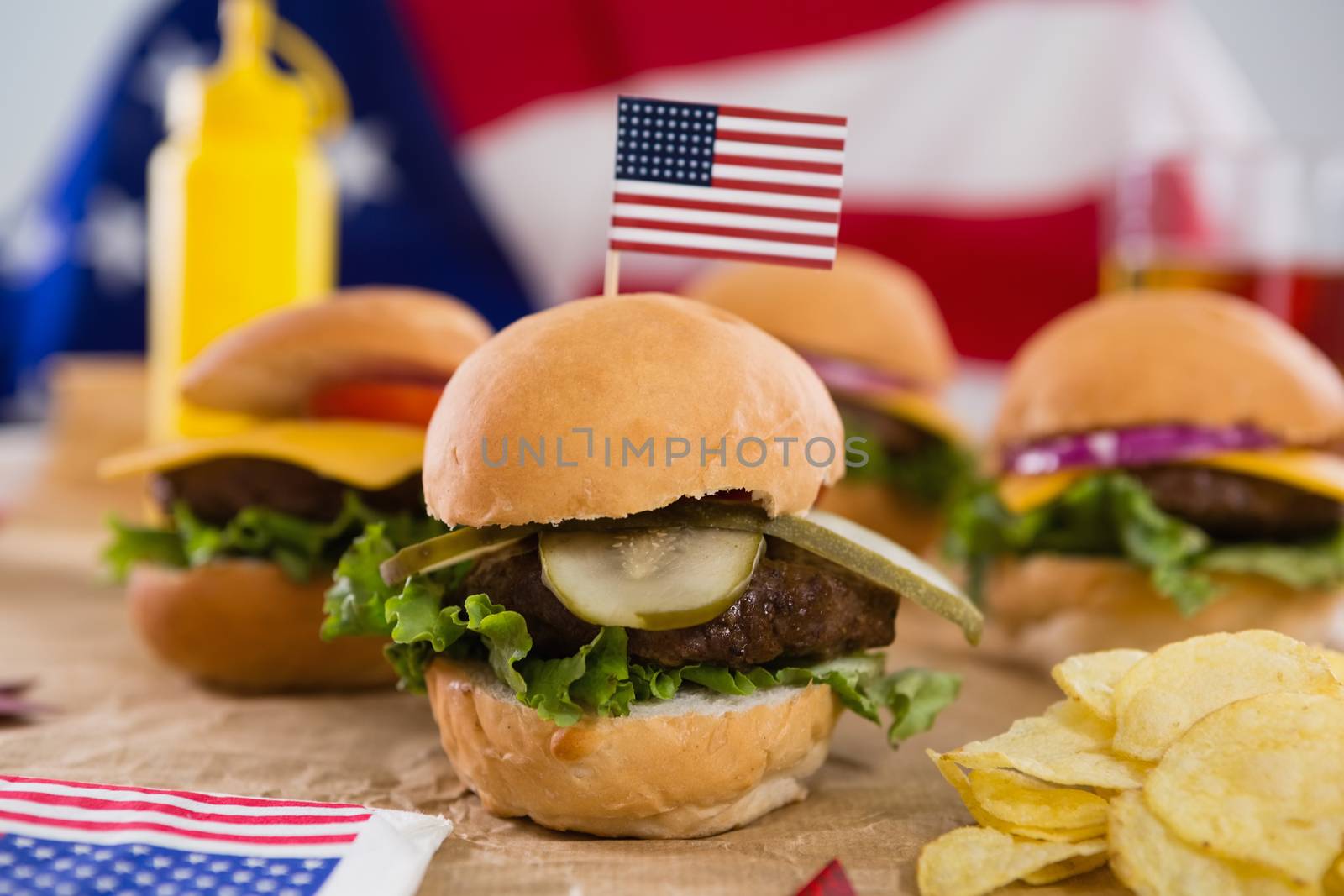 Close-up of burger decorated with 4th july theme on wooden table