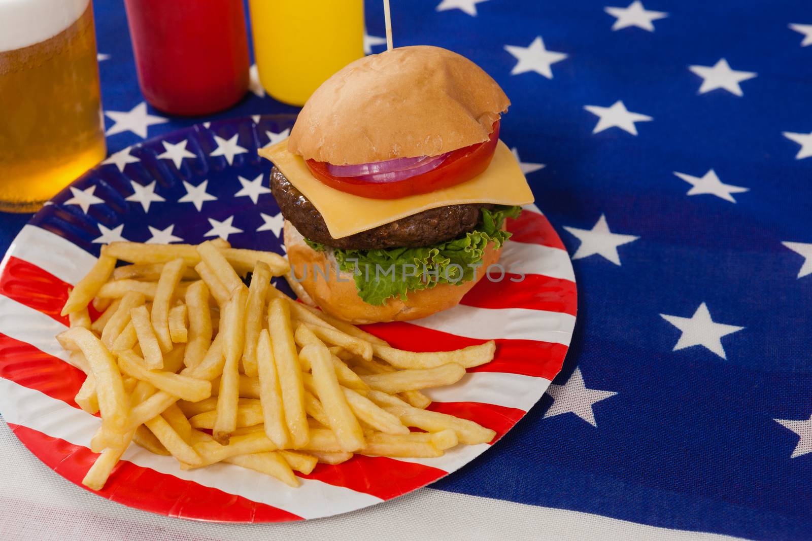 Snacks and drink  decorated with 4th july theme by Wavebreakmedia