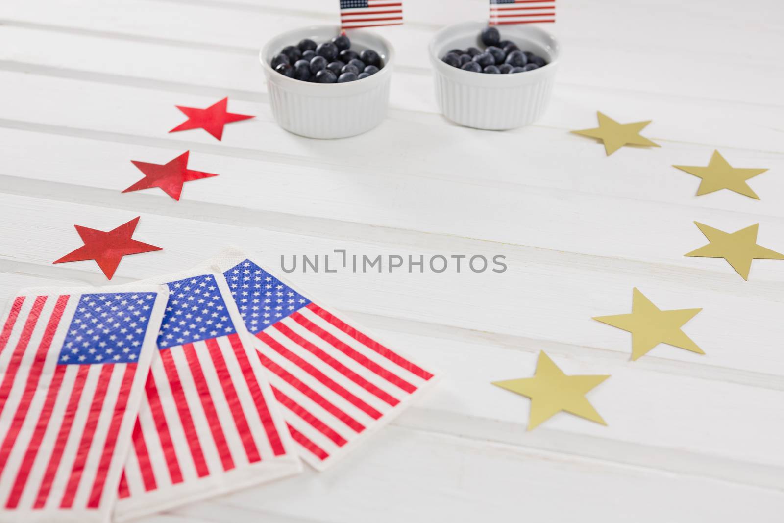 Black berries decorated with 4th july theme on wooden table