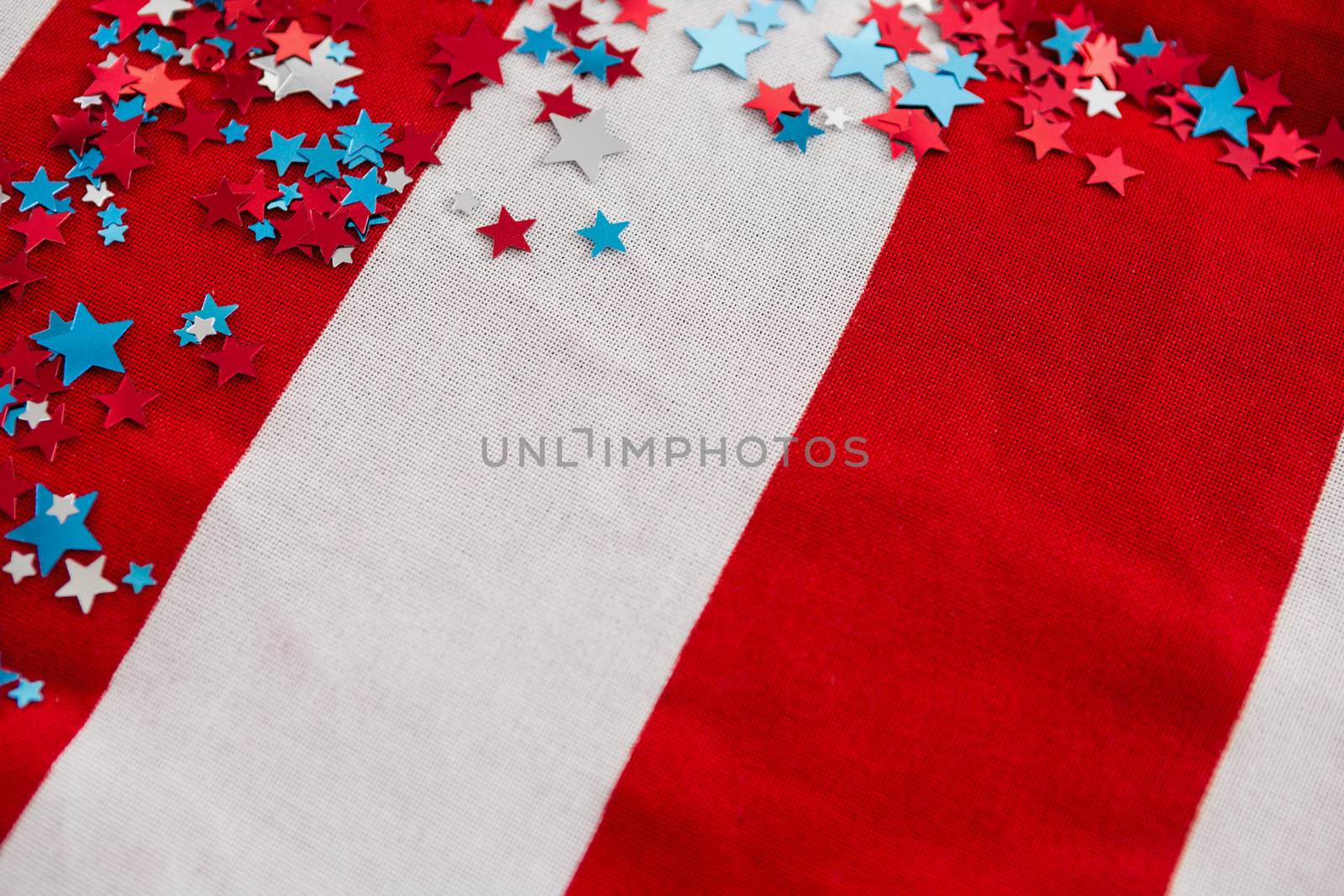 Star shape decoration arranged on American flag by Wavebreakmedia