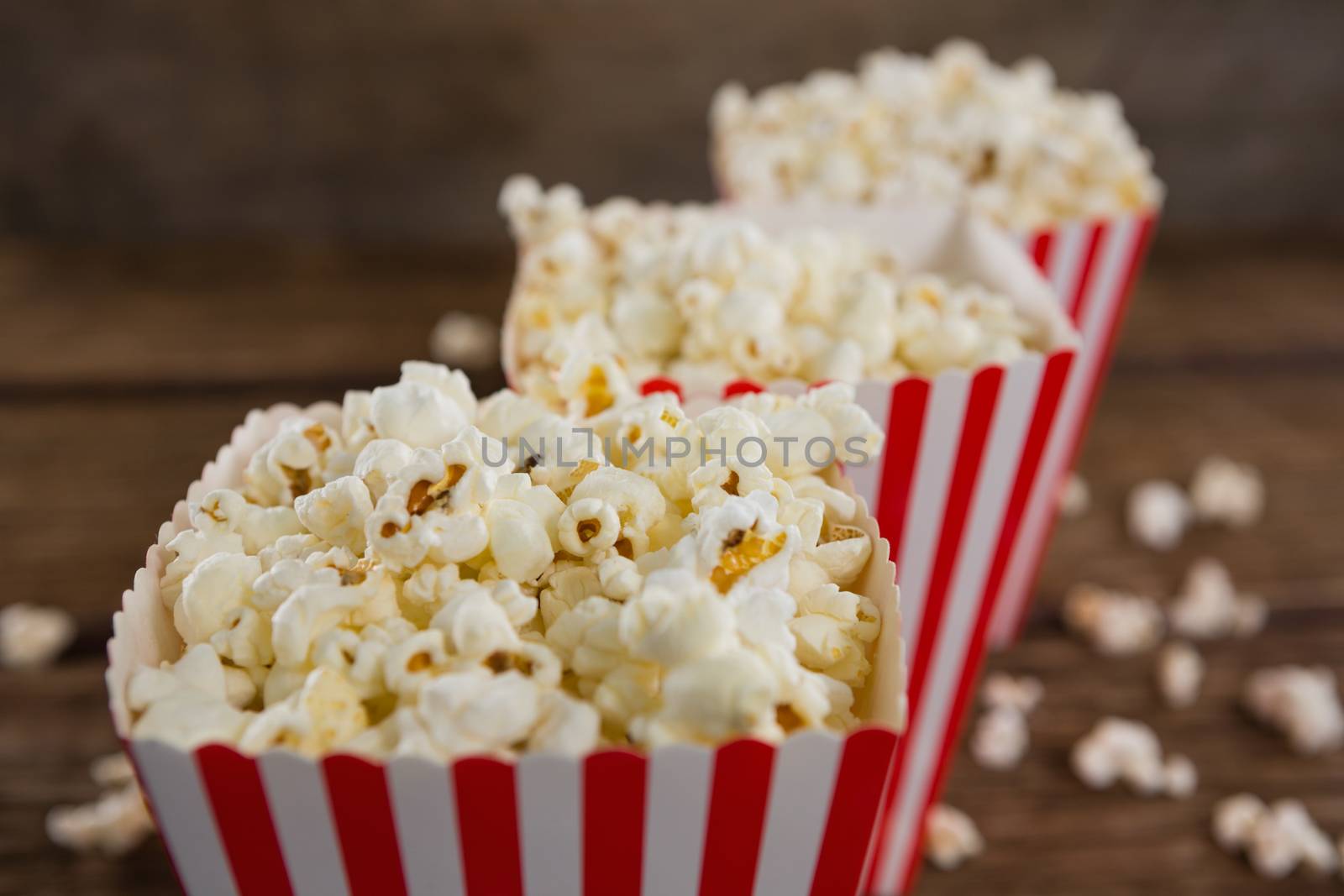Popcorn arranged in a row with 4th july theme by Wavebreakmedia