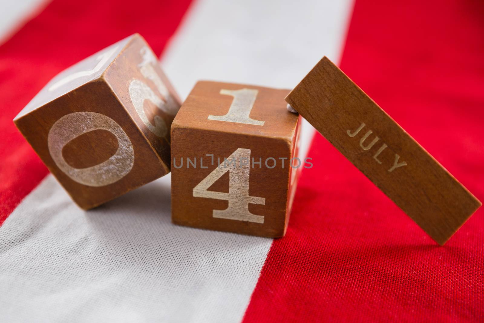 Date blocks on American flag with 4th july theme by Wavebreakmedia