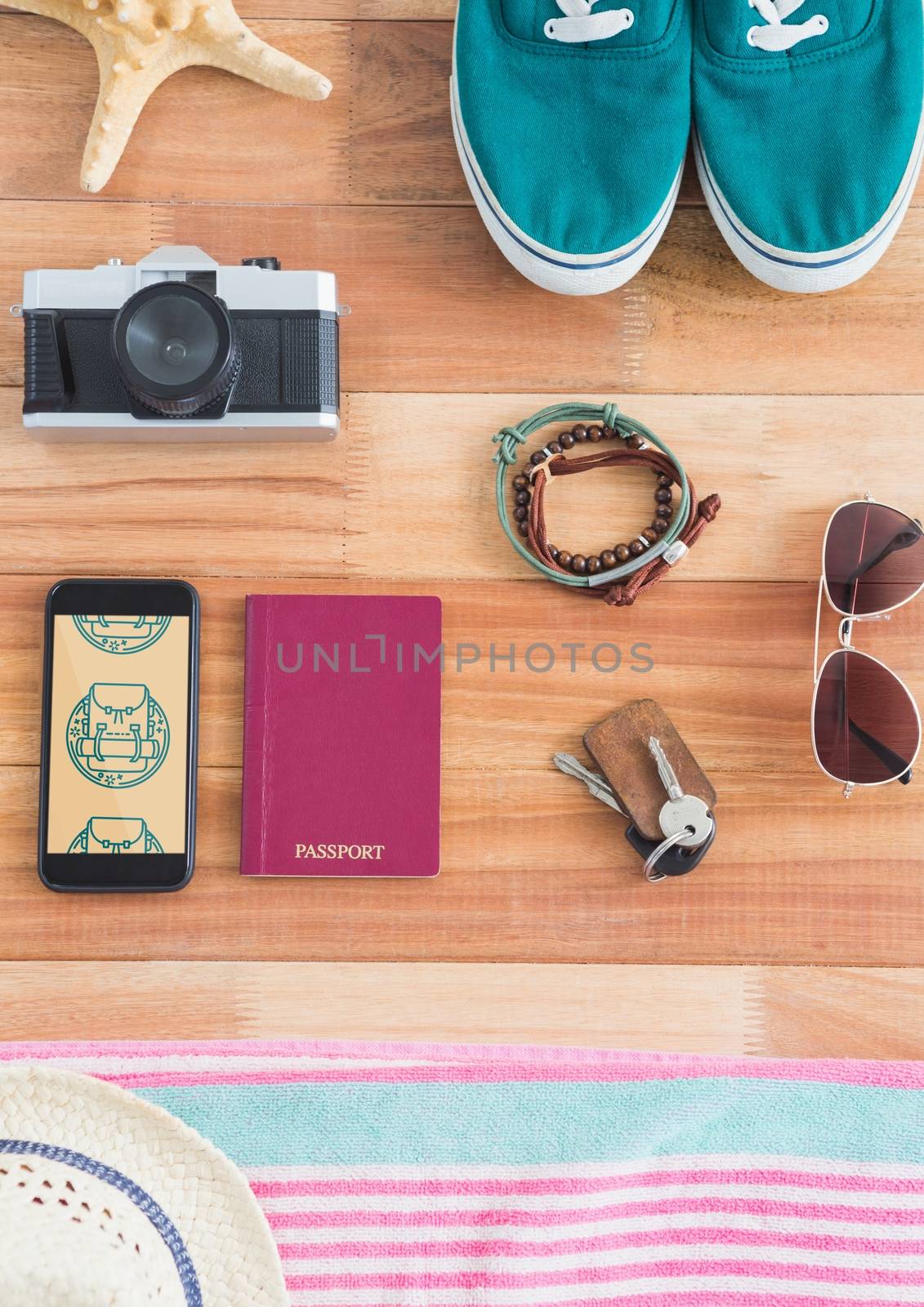 Phone with travel icons on the screen by Wavebreakmedia