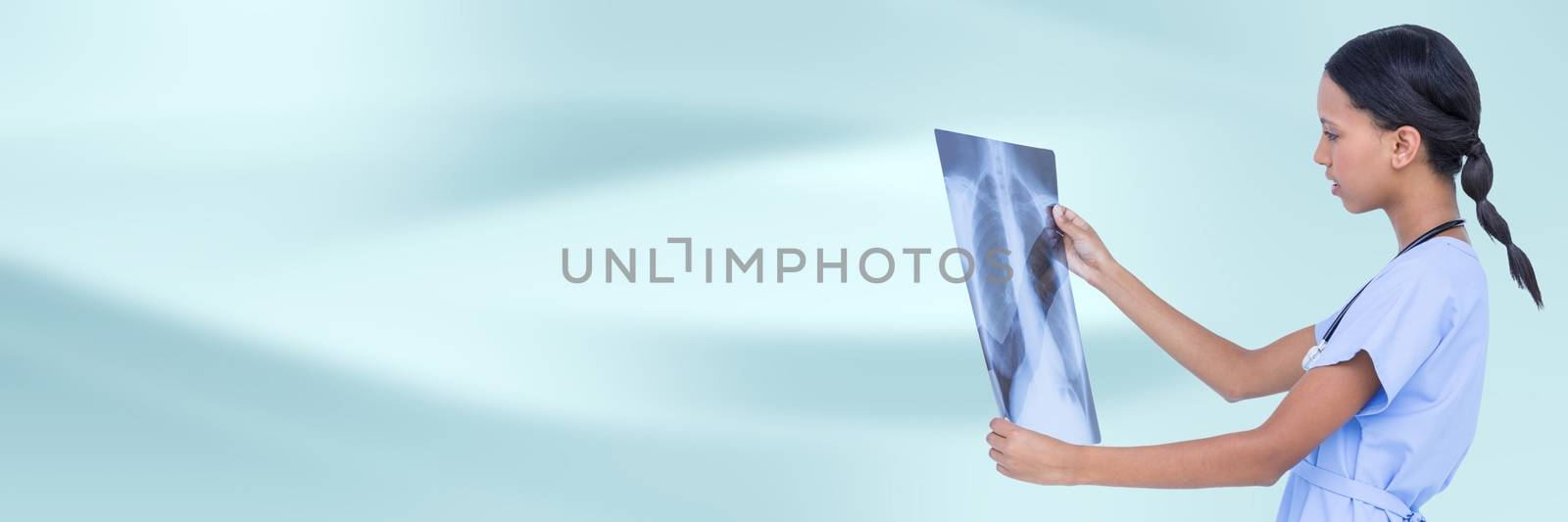 Digital composite of Doctor with x-ray against blue abstract background