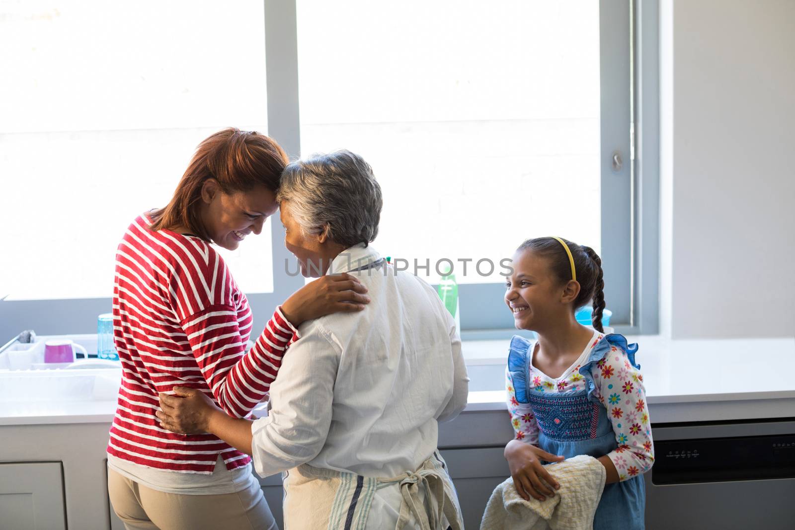 Happy family having fun in kitchen by Wavebreakmedia