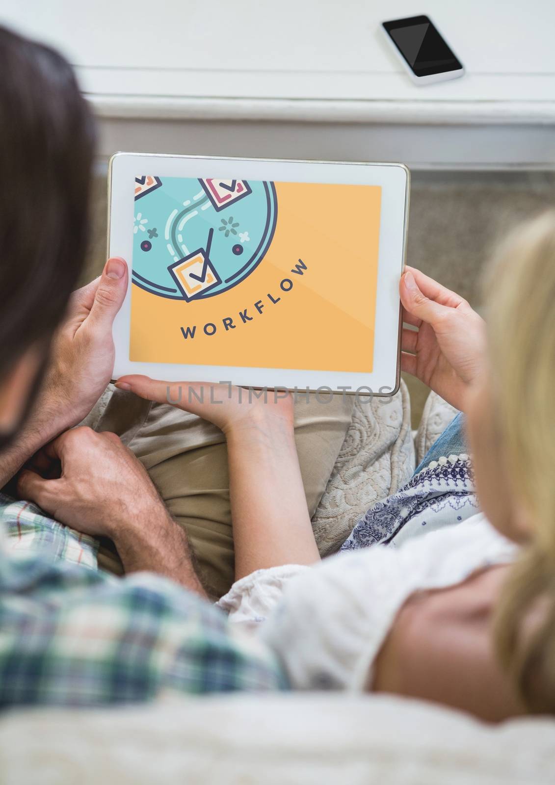 People looking at a tablet with education icon on the screen by Wavebreakmedia