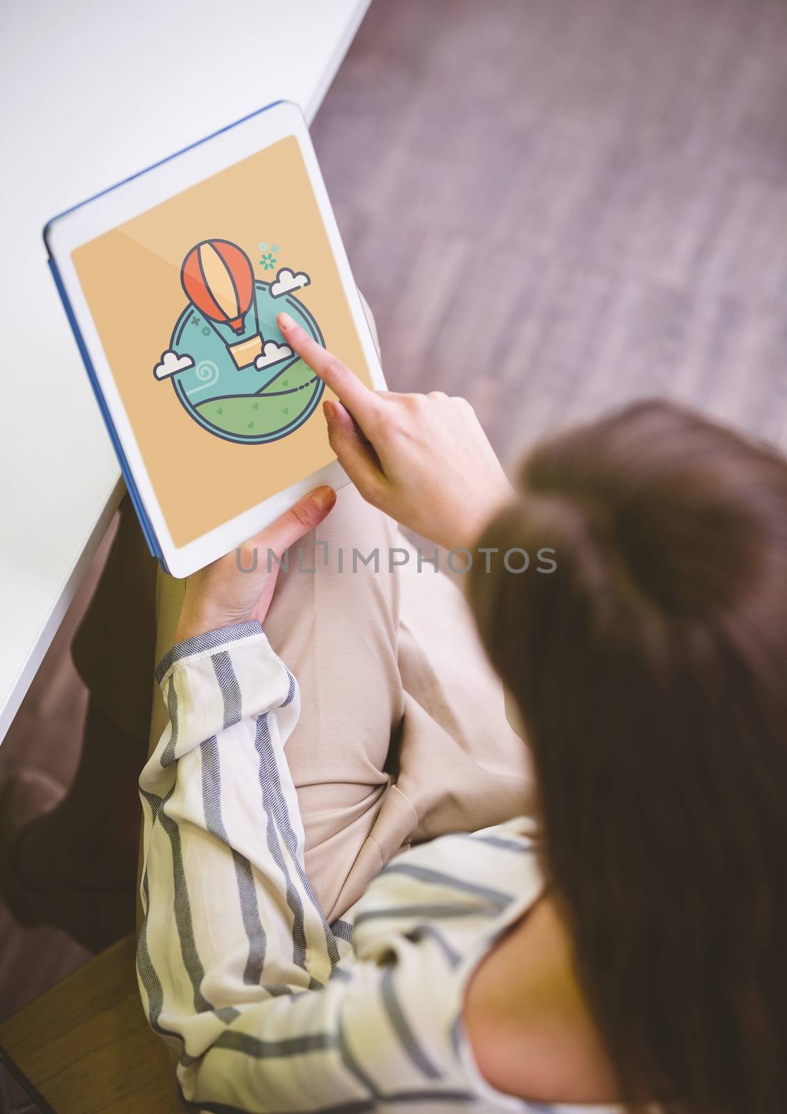 Digital composite of Woman holding a tablet with travel icon on the screen