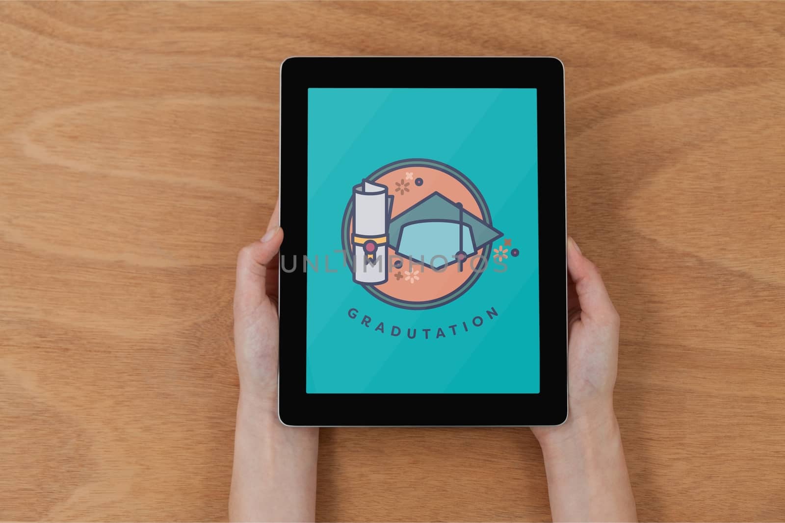 Person holding a tablet with education icon on the screen by Wavebreakmedia