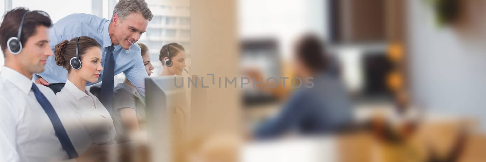 Digital composite of Call centre employees and blurry image of people at computer