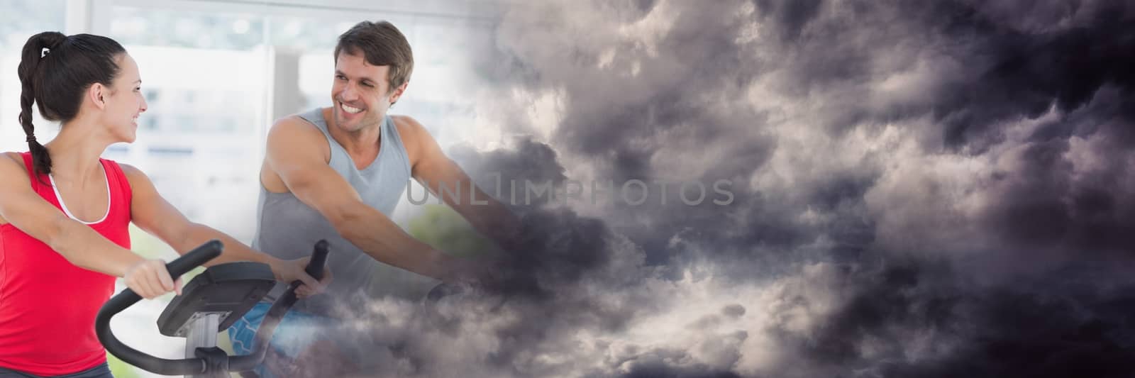 Digital composite of People smiling on gym bikes with stormy cloud transition