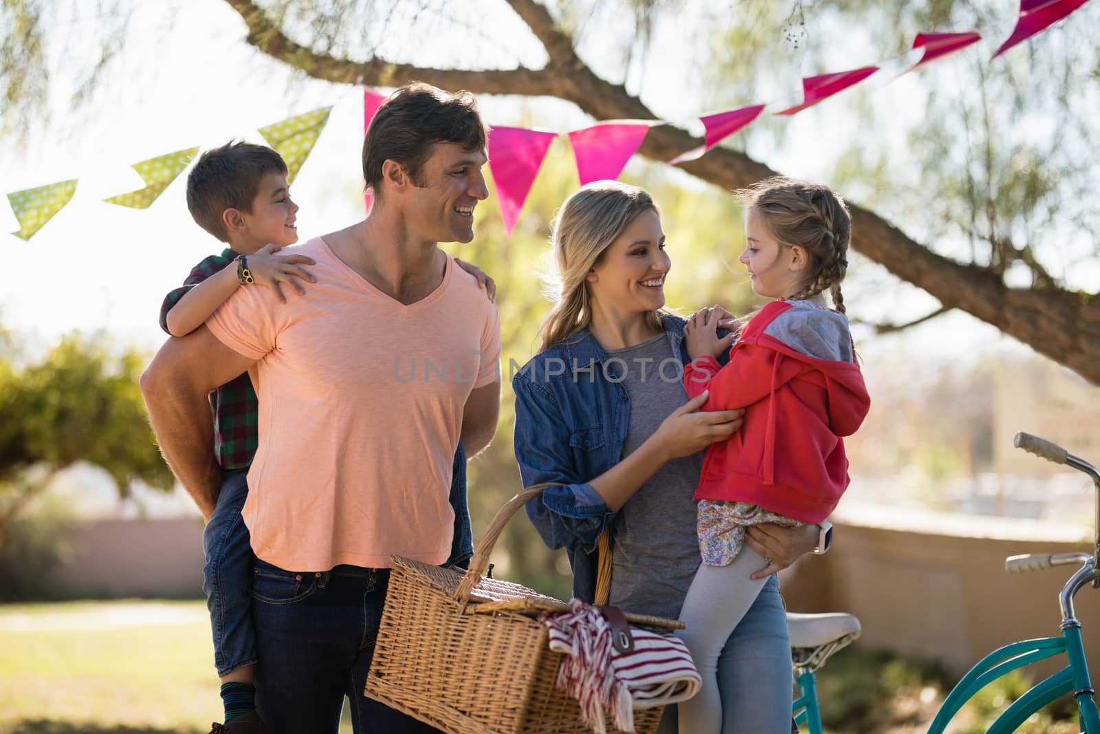 Happy family enjoying together in the park on a sunny day