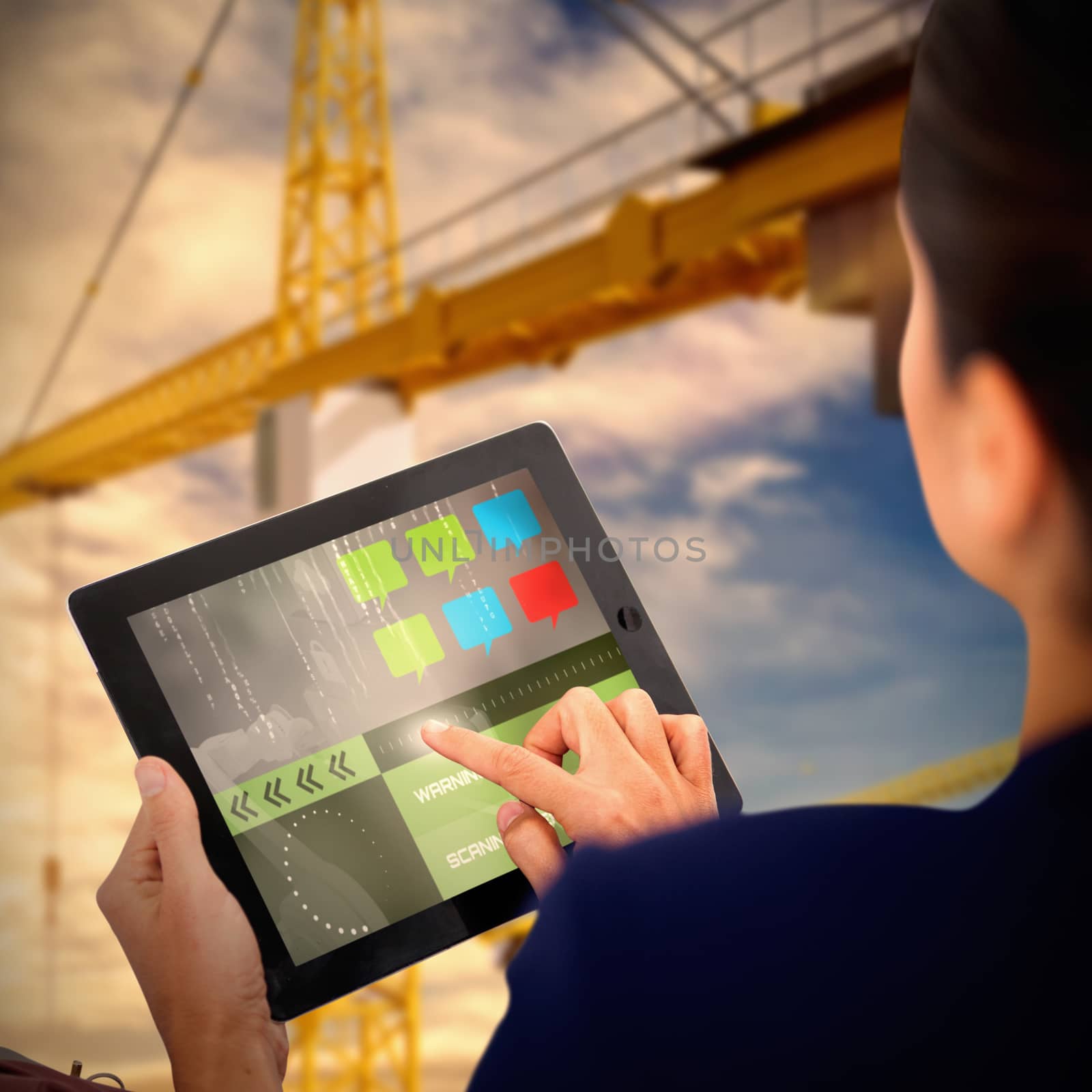 Businesswoman working on digital tablet over white background against 3d image of yellow and red cranes