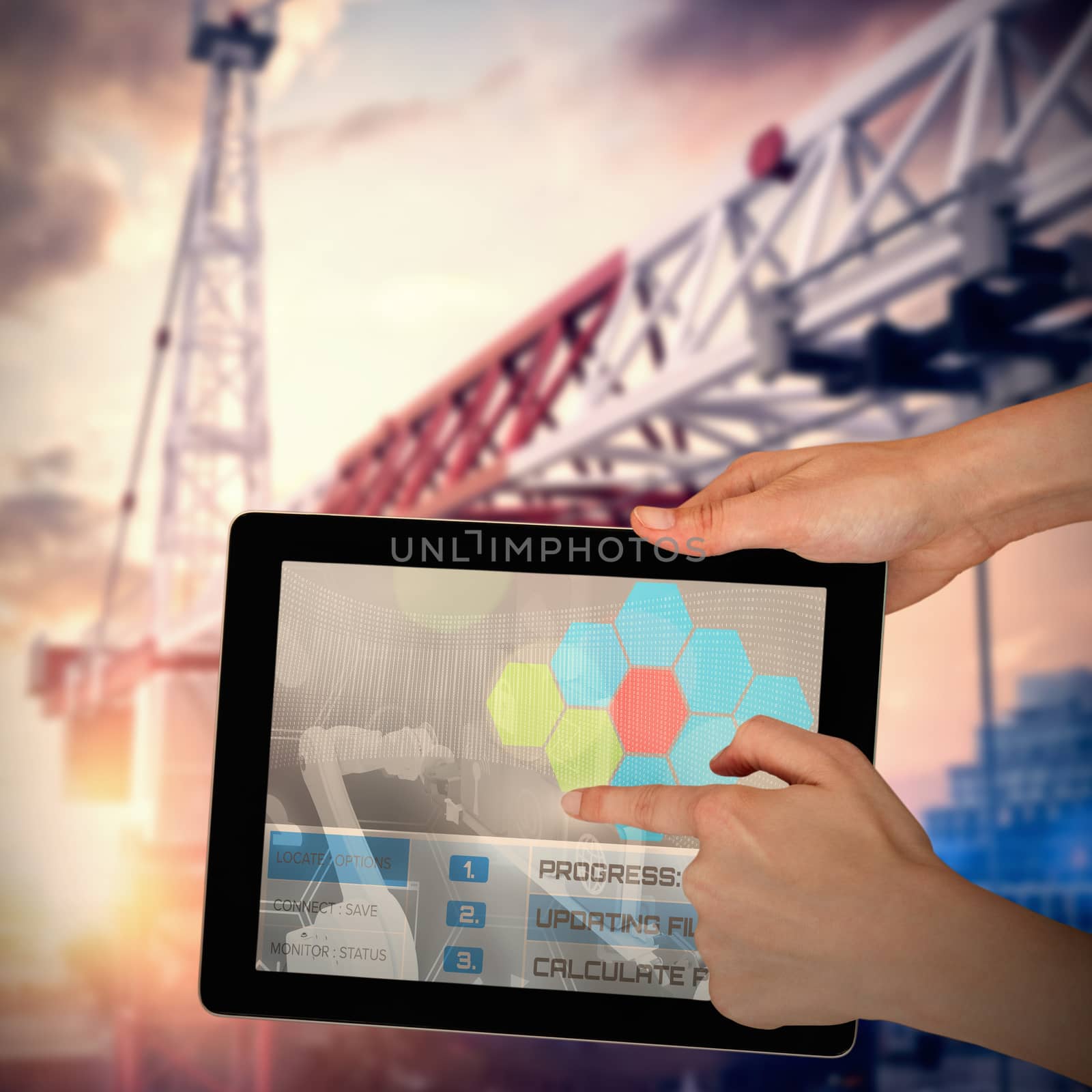 Hands touching digital tablet against white background against 3d image of crane in city during sunset