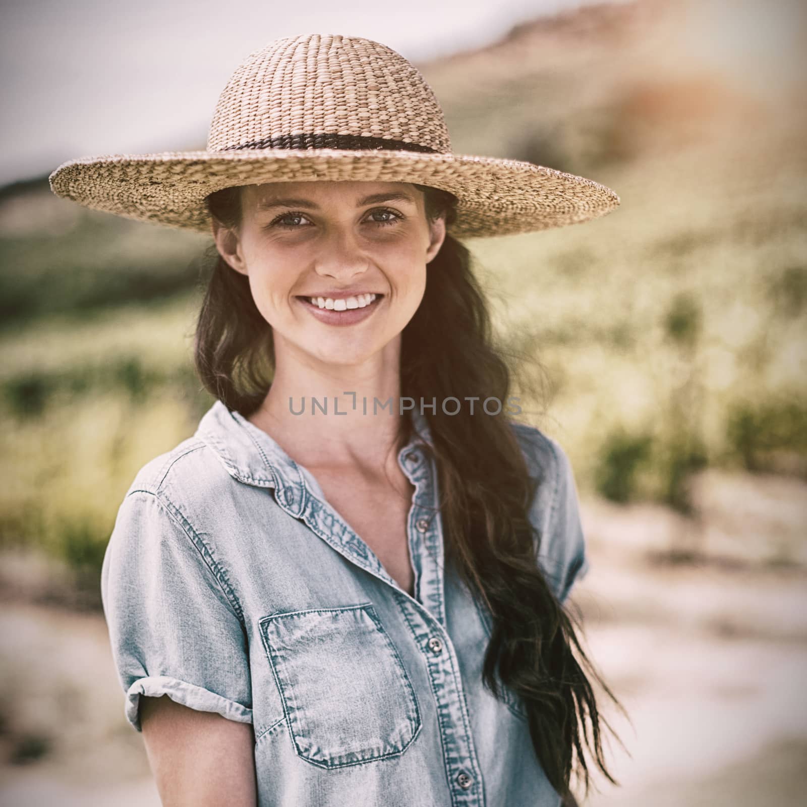 Portrait of woman holding bread with cheese and meat on wooden tray by Wavebreakmedia