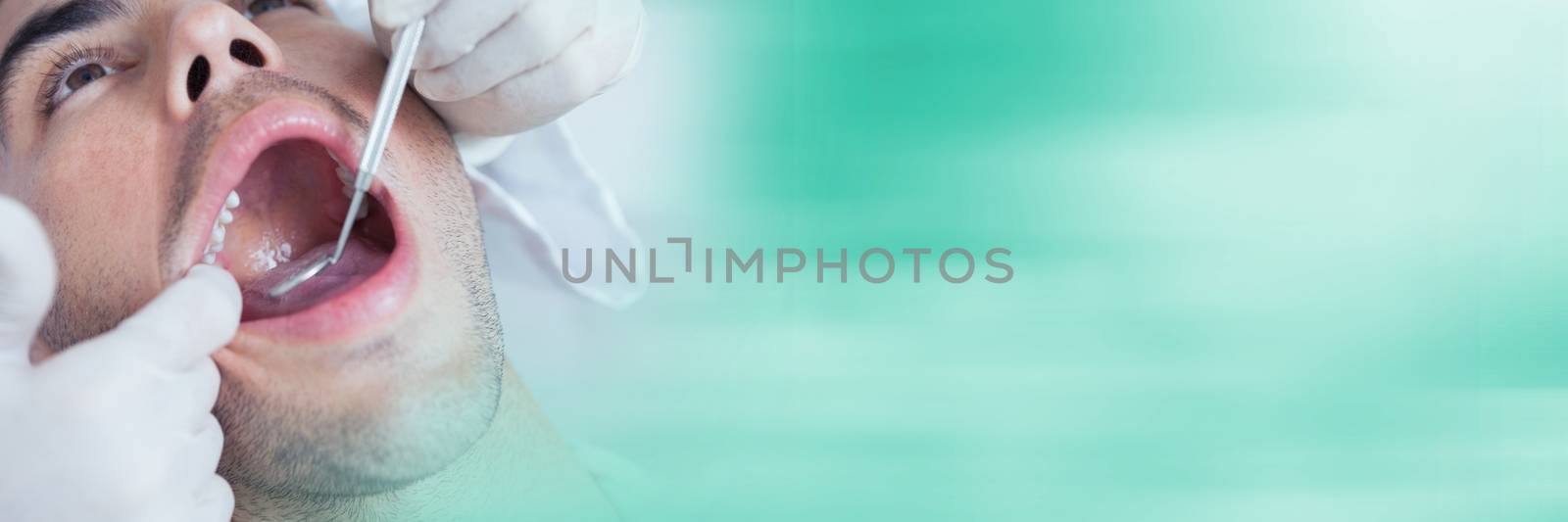 Digital composite of Close up of dentist working on patient and blurry teal transition
