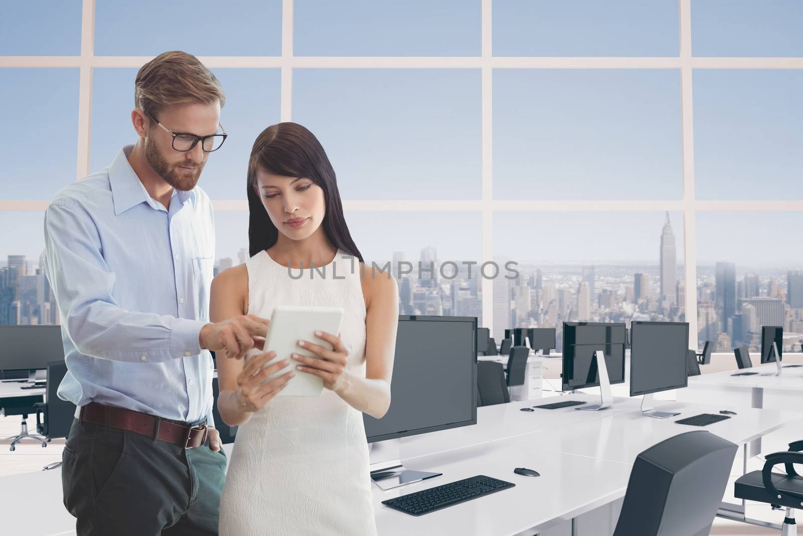 Digital composite of Business people looking at a tablet