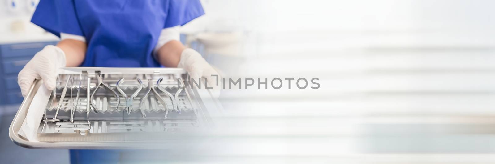 Digital composite of Close up of dentist with tray and blurry white transition