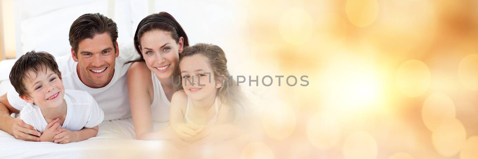 Digital composite of Family lying on floor smiling at camera wide shot