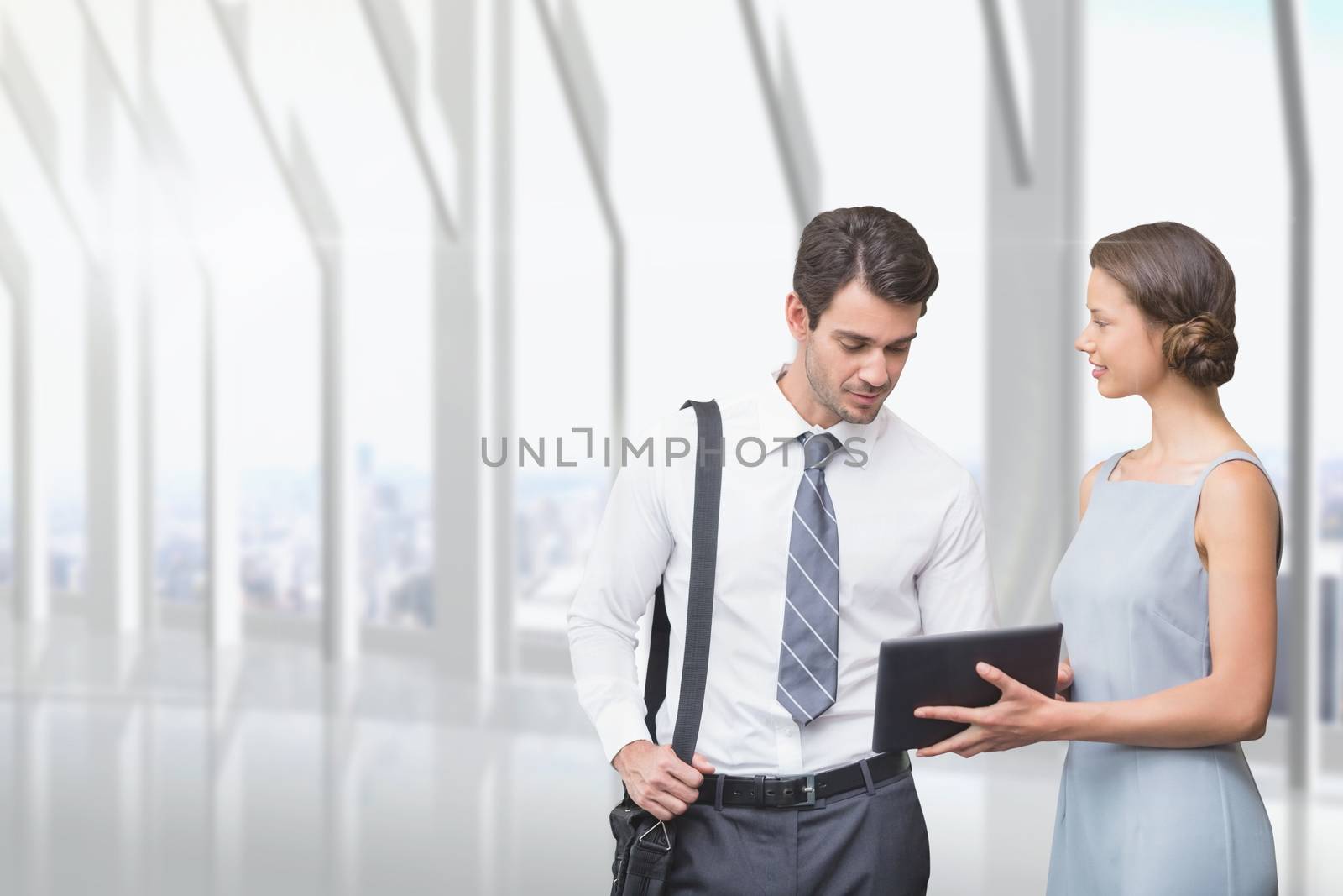 Business people looking at a tablet by Wavebreakmedia