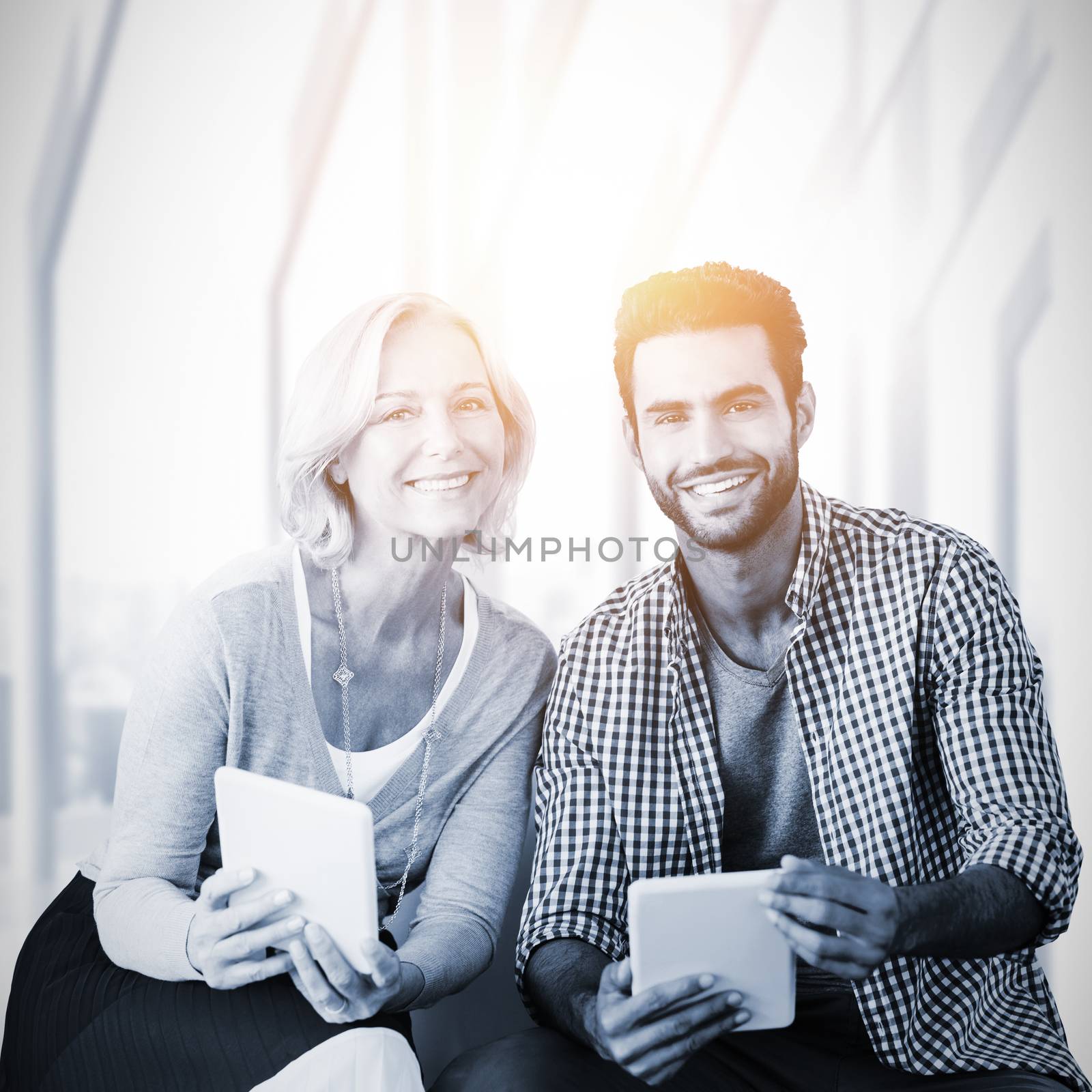 Composite image of smiling business people looking at camera by Wavebreakmedia
