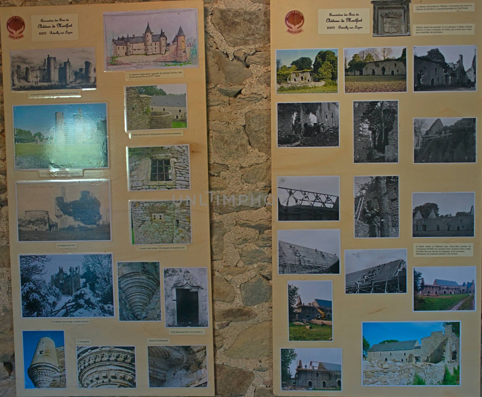 Montfort-sur-Risle, FRANCE - April 14th 2019 - Boards with old photograph of Monfort castle on stone wall