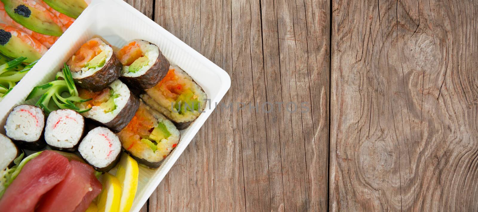 Composite image of sushi served in tray over white background by Wavebreakmedia