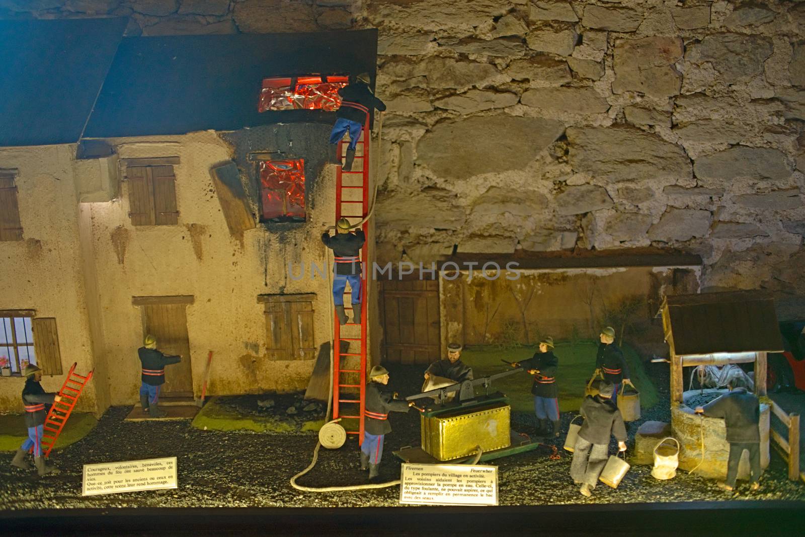 Small scale model representing firefighters from the past