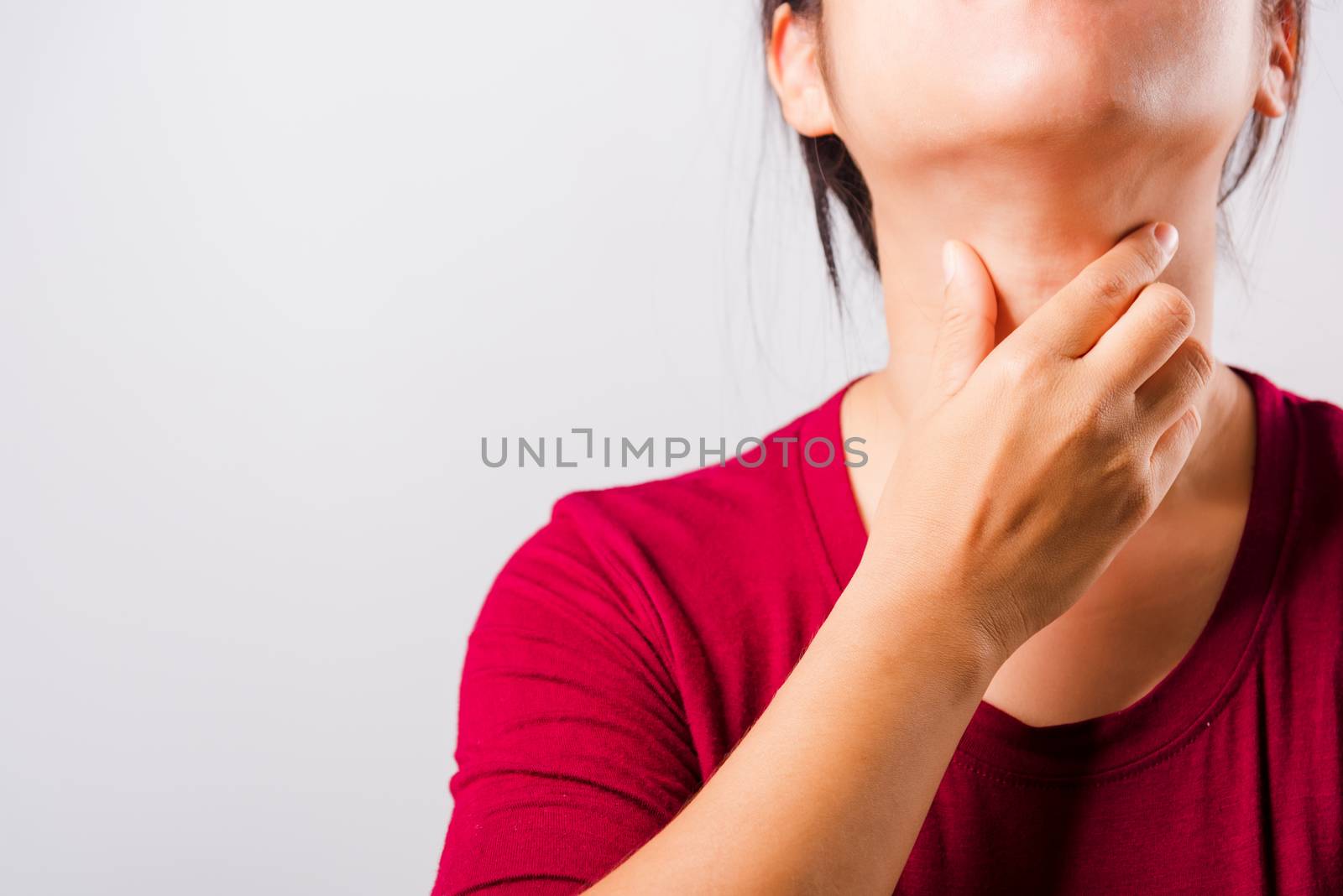Asian beautiful woman itching her scratching her itchy neck on white background with copy space, Medical and Healthcare concept